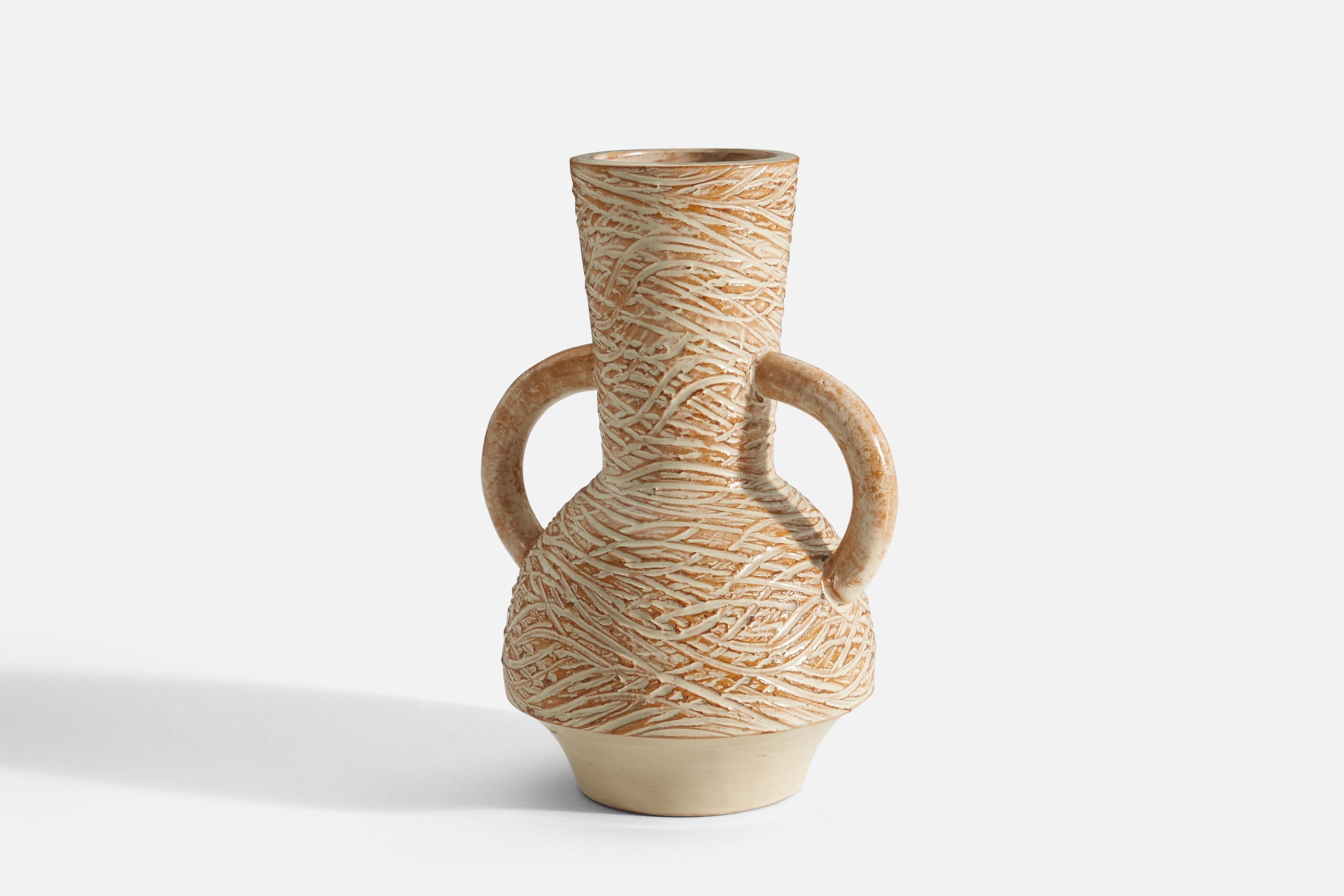 An orange and cream colored vase designed and produced by Andersson & Johansson, Sweden, c. 1940s. This vase features an incised linear and abstract motif along with classically proportioned handles.