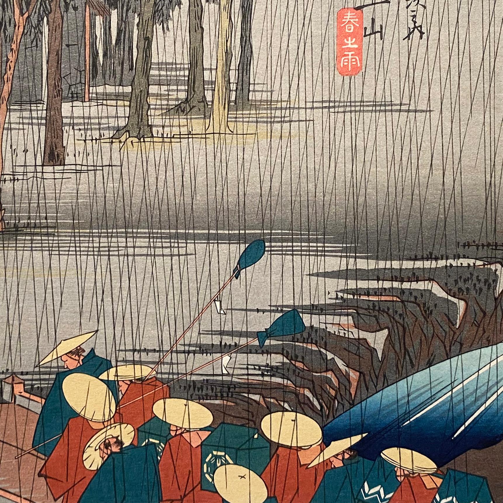 Paysage à l'encre sur papier, gravure sur bois Nishiki-e et Yoko-e, représentant une procession de daiymo prise dans la pluie. Signée en kanji en bas à gauche, 