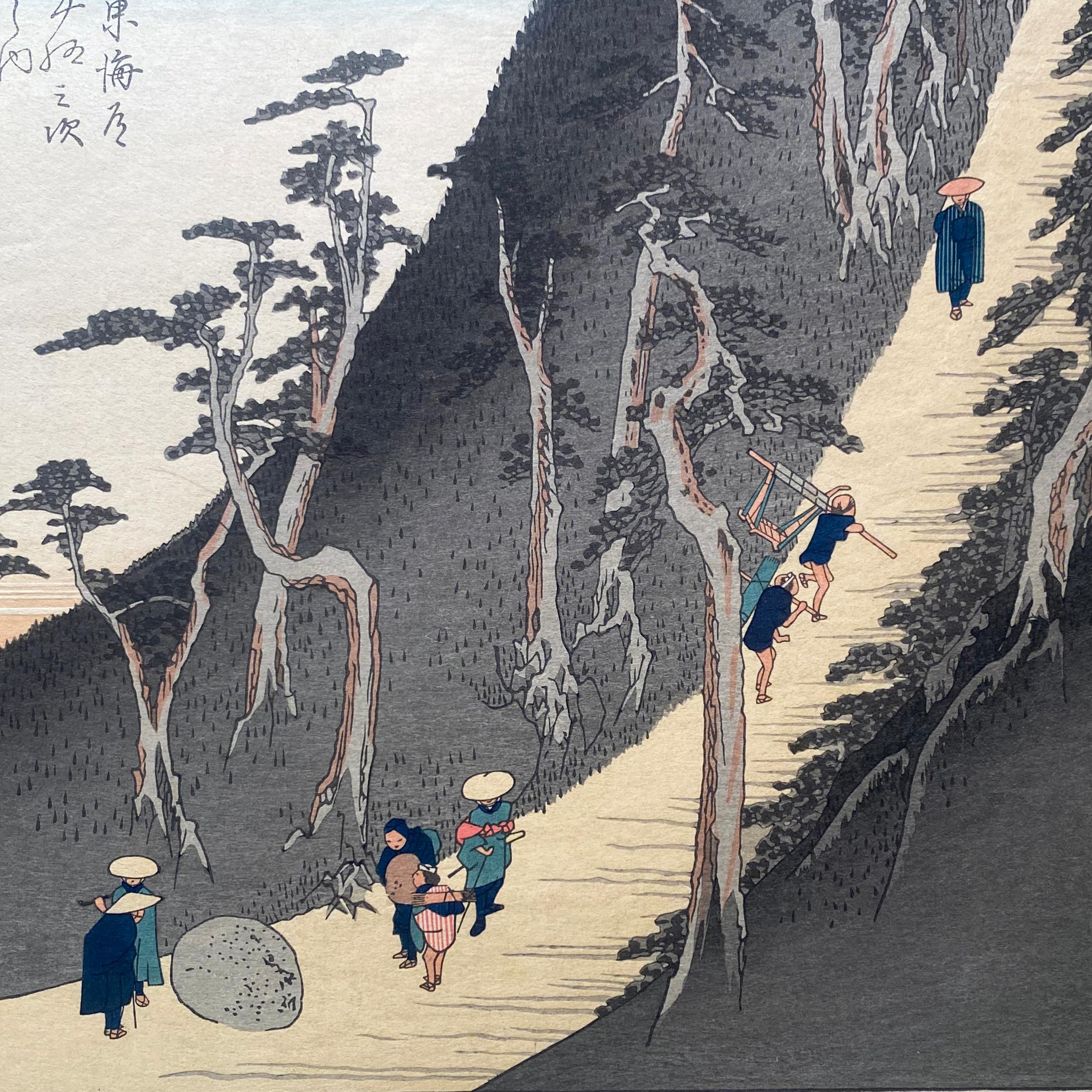 An ink on paper, Nishiki-e and Yoko-e woodblock landscape showing travelers moving through Sayo Mountain Pass. Signed in Kanji upper left, 