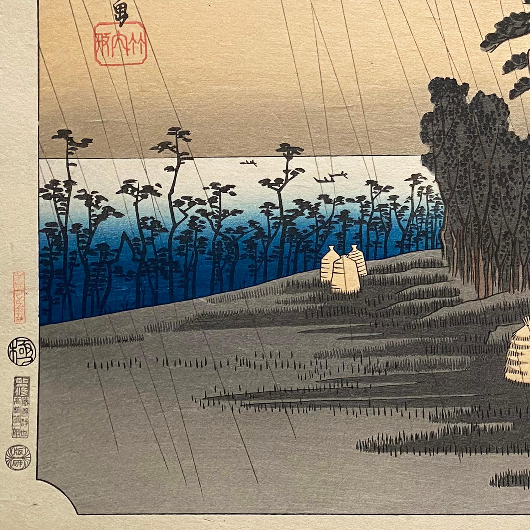 An ink on paper, Nishiki-e and Yoko-e woodblock landscape showing travelers entering the coastal town of Oiso on a rainy evening, circa 1850. Signed in Kanji upper left, 