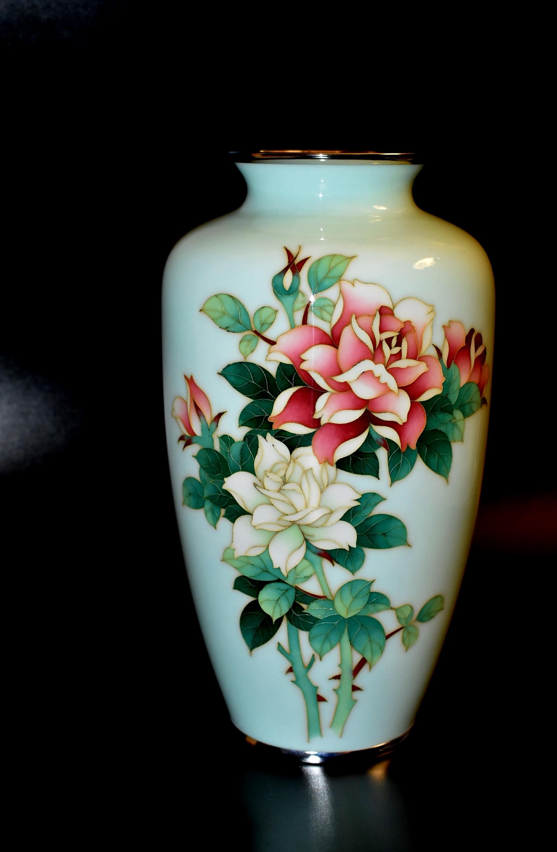 A beautiful, vintage, near perfect condition Ando Jubei vase featuring roses. Elegant form, perfect size and the finest finish in high gloss. Perfectly smooth to touch. Rim and base finished in silver metal. Signed with the artist's mark on the