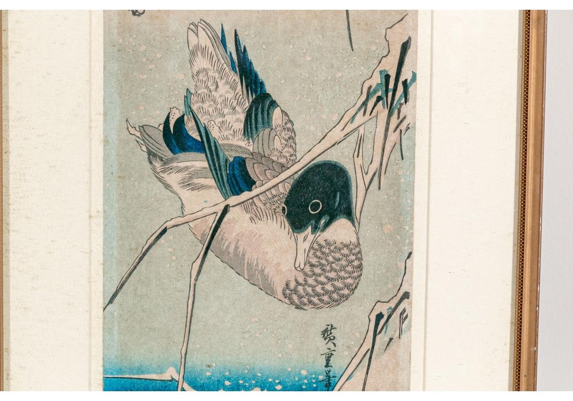 Woodblock print depicting a mallard duck beneath the reeds surmounted on paper.. Presented in a wood frame with fine beading, matted and glazed.
Black calligraphy inscription upper left.
Gallery label on verso
Seal lower right.

Dimensions:
Work: 6