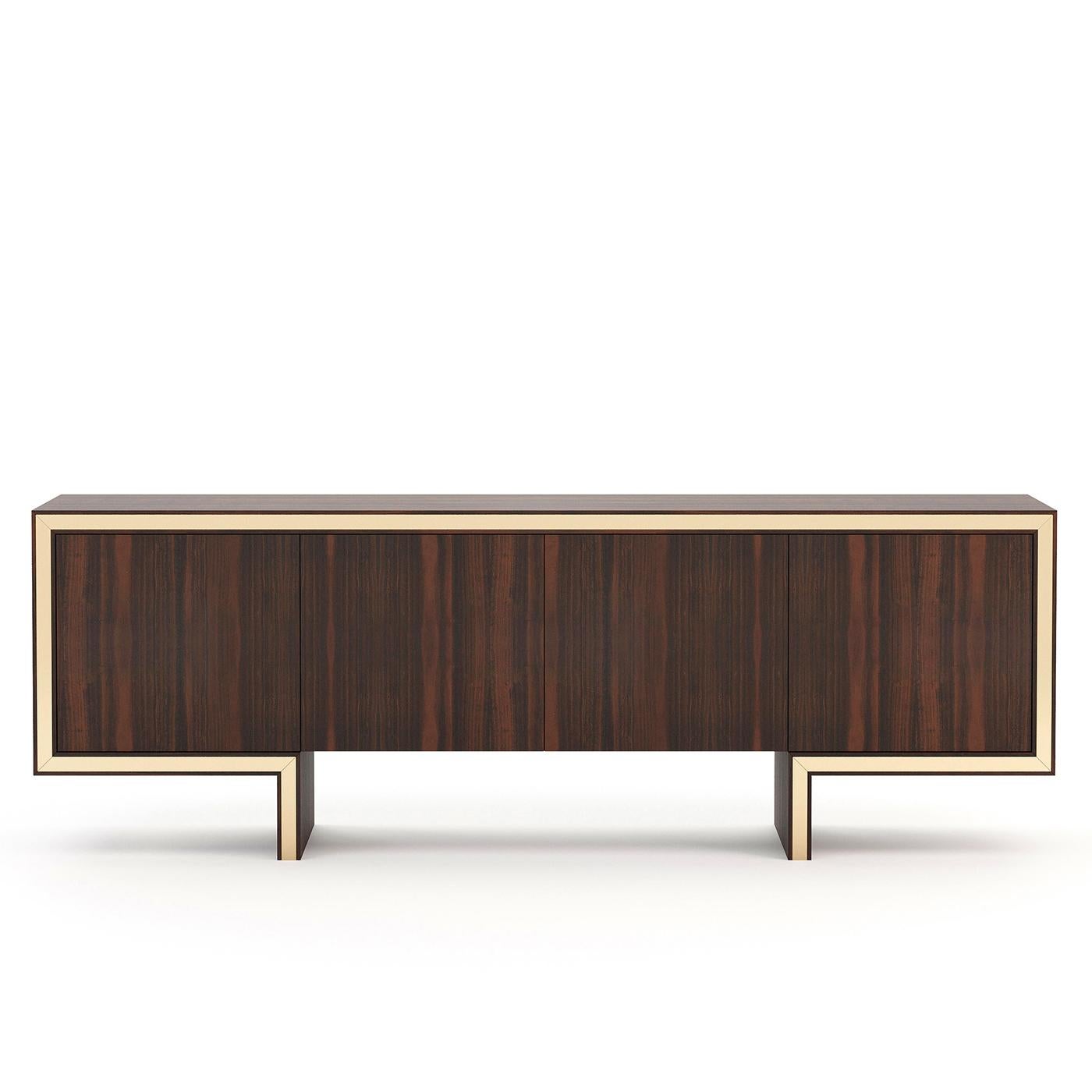 Sideboard Andora with structure in eucalyptus wood
veneer in matte finish, with 4 doors and with 1 shelf on 
each part. With polished stainless steel trim in gold finish.
Measures: L 200 x D 50 x H 83cm, price: 7800,00€.
Also available in ebony