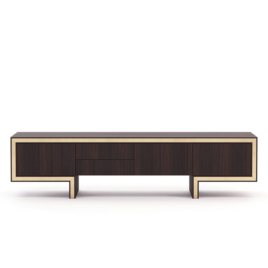 Sideboard Andora TV with structure in smocked eucalyptus veneered
wood in matte finish, with polished stainless steel trim in gold finish.
With 3 doors and 2 drawers with easy glide system.
Also available in ebony matte finish, or grey oak matte