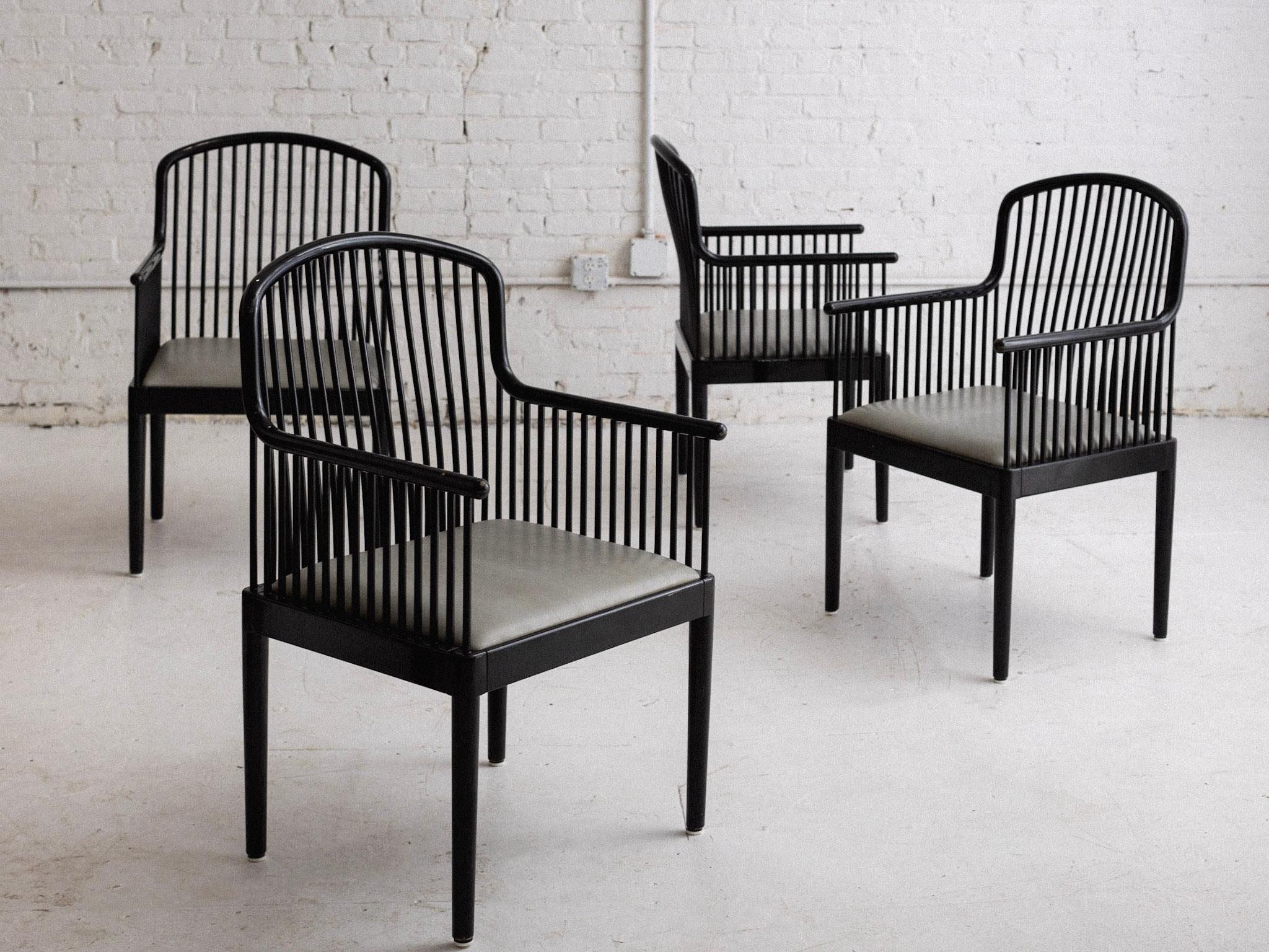 A set of four “Andover” chairs by Davis Allen for Stendig. Black lacquer finish and gray vinyl seats. Retains original “Stendig” and “Collaudo” tags.
