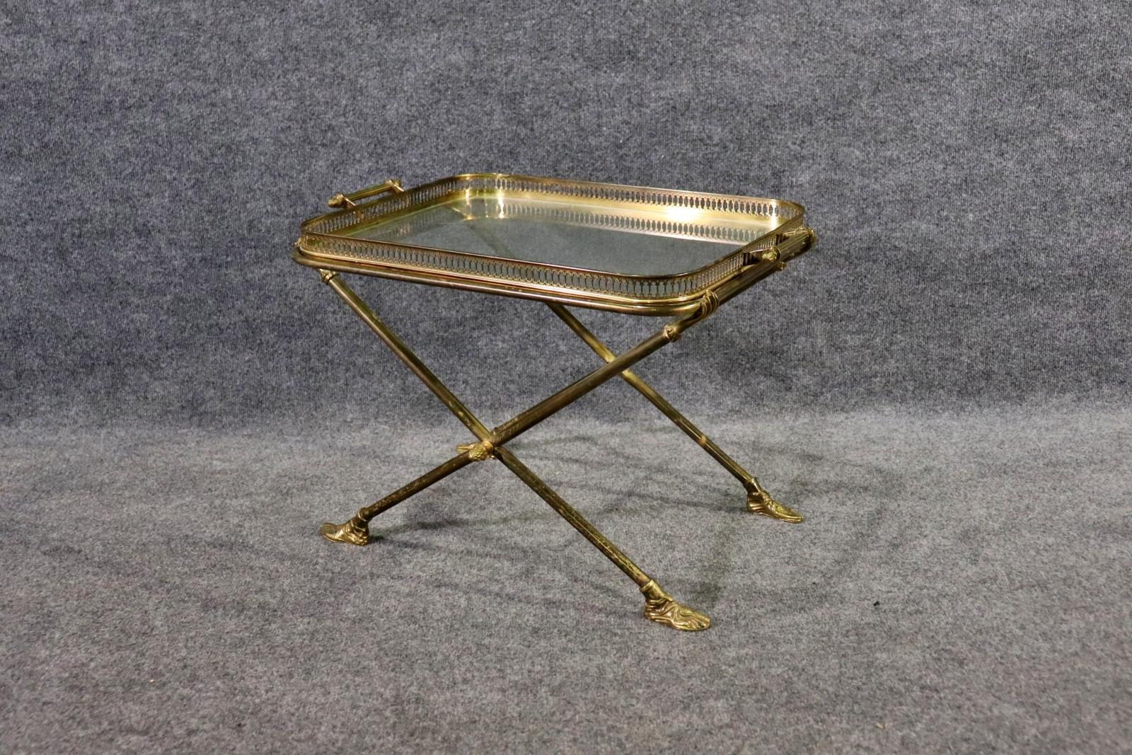 Gilt Brass & Glass Bar Side Table Removable Top Tray. Stylish 60s-70s Hollywood Regency, glass & Brass bar side table with removable top tray. Sculptural hands and feet holding and supporting the tray. 

Dimensions: .18