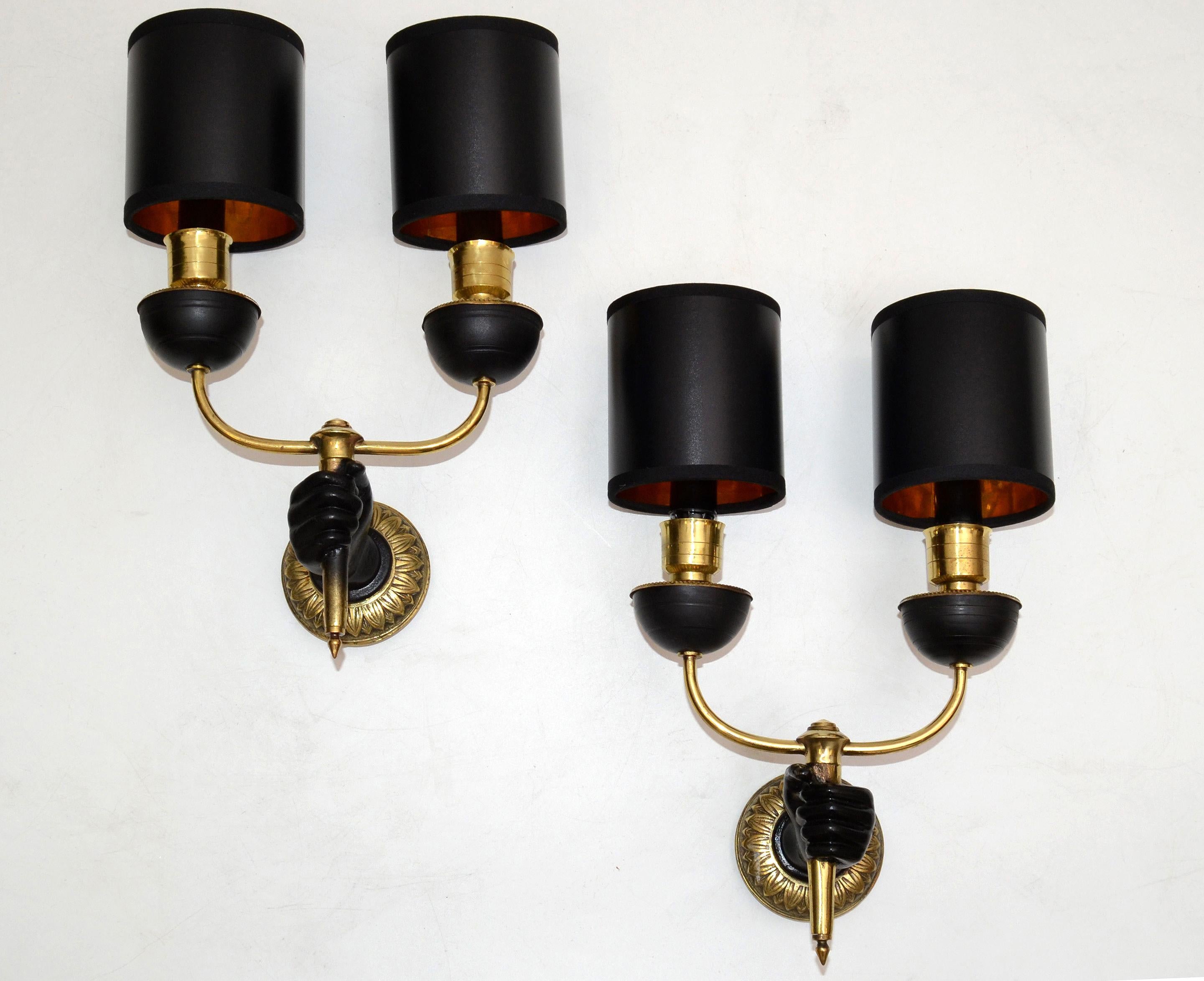 Very elegant pair of André Arbus French bronze neoclassical black hand sconce with two arms, wall light with black & gold paper shades.
Priced by pair.
US rewiring and each takes 2 light bulb max. 40 watts.
Measures: Back-plate measures: Diameter