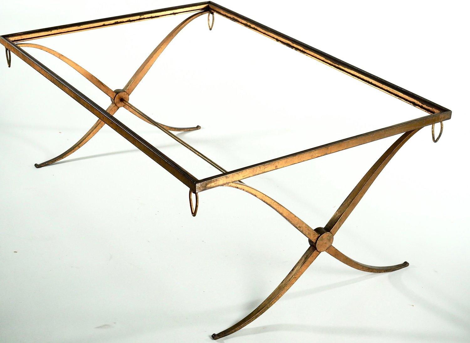 French Art Deco, circa 1937 large-scale coffee table by Andre Arbus in gilt iron. Variant of the model presented by Arbus at the 1937 Exposition Internationale des Arts et Techniques dans la Vie Moderne (International Exposition of Art and