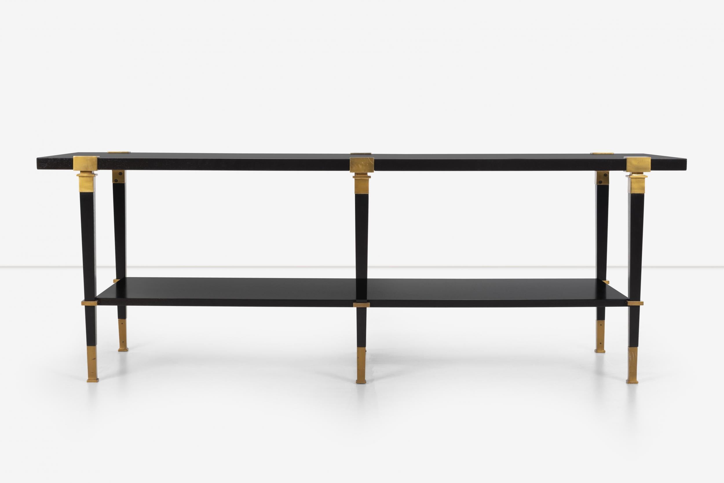 Andre Arbus for Baker Avenue Cocktail table with lower shelf, solid walnut with ebonized finish and disengaged solid brass capitals over square tapered legs with brass feet.
Arbus designed this in 1958 for Paris Gallery Owner Aime Maeght on Avenue