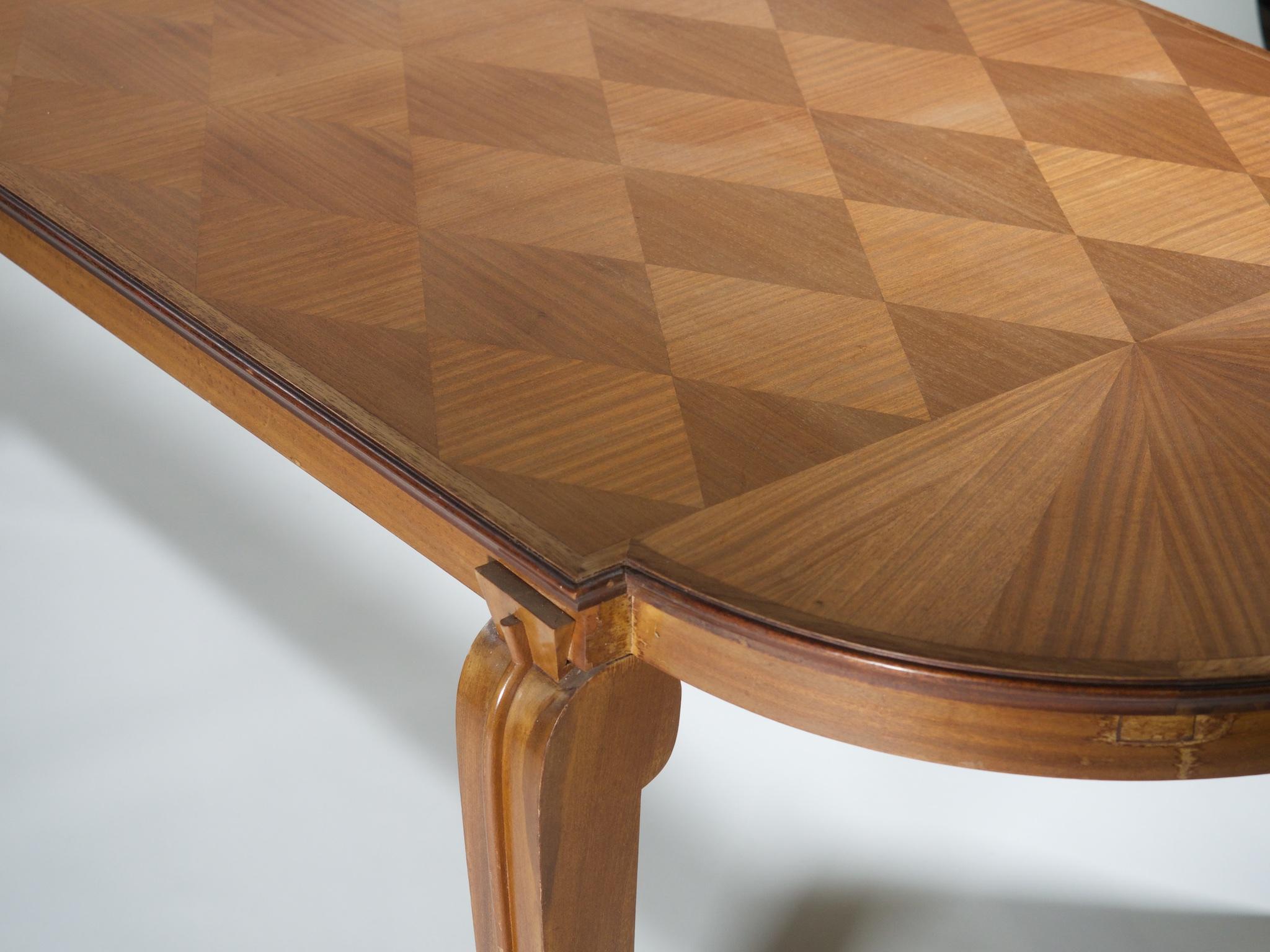 French Art Deco dining table by Andre Arbus, circa 1938, in mahogany. This signed and documented model is featured in the book, Andre Arbus, by Yvonne Brunhammer (1996) and a variant is presented in the October 1938 issue of Mobilier et Decoration