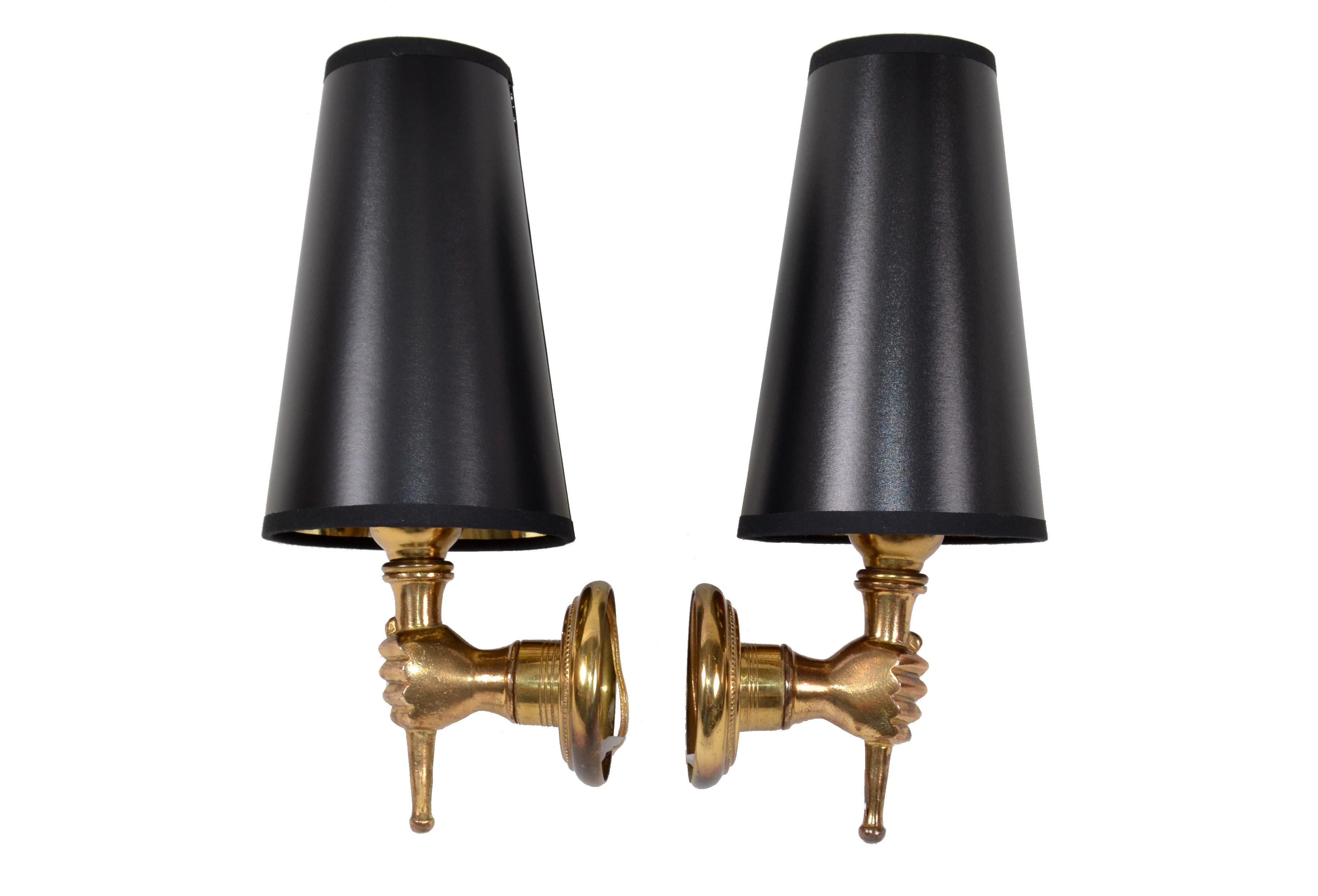 Very elegant André Arbus French bronze neoclassical hand sconces, wall lamps.
Priced by pair.
US rewiring and each takes a light bulb max. 40 watts.
Measures: back-plate measures: diameter 3.5 inches.
Height to top of socket is 5.25 inches.
Sold