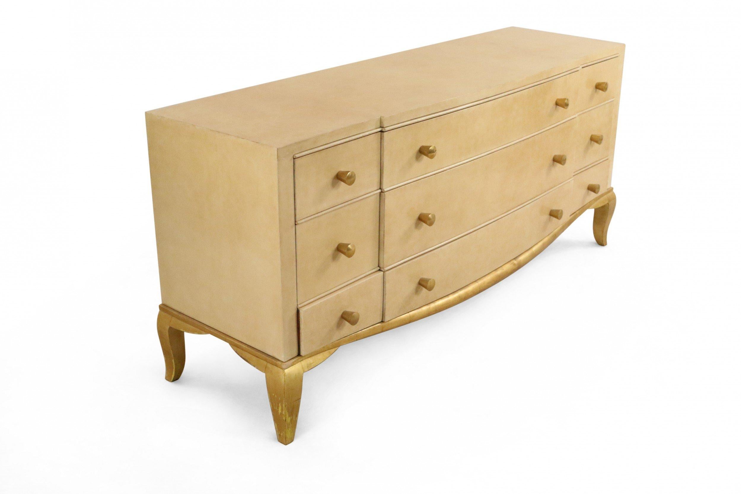 French mid-century (1930s) parchment veneer chest of drawers with three wide central drawers and three smaller drawers on each side having oval brass drawer pulls on cabriole giltwood legs. (attributed to ANDRE ARBUS).
 