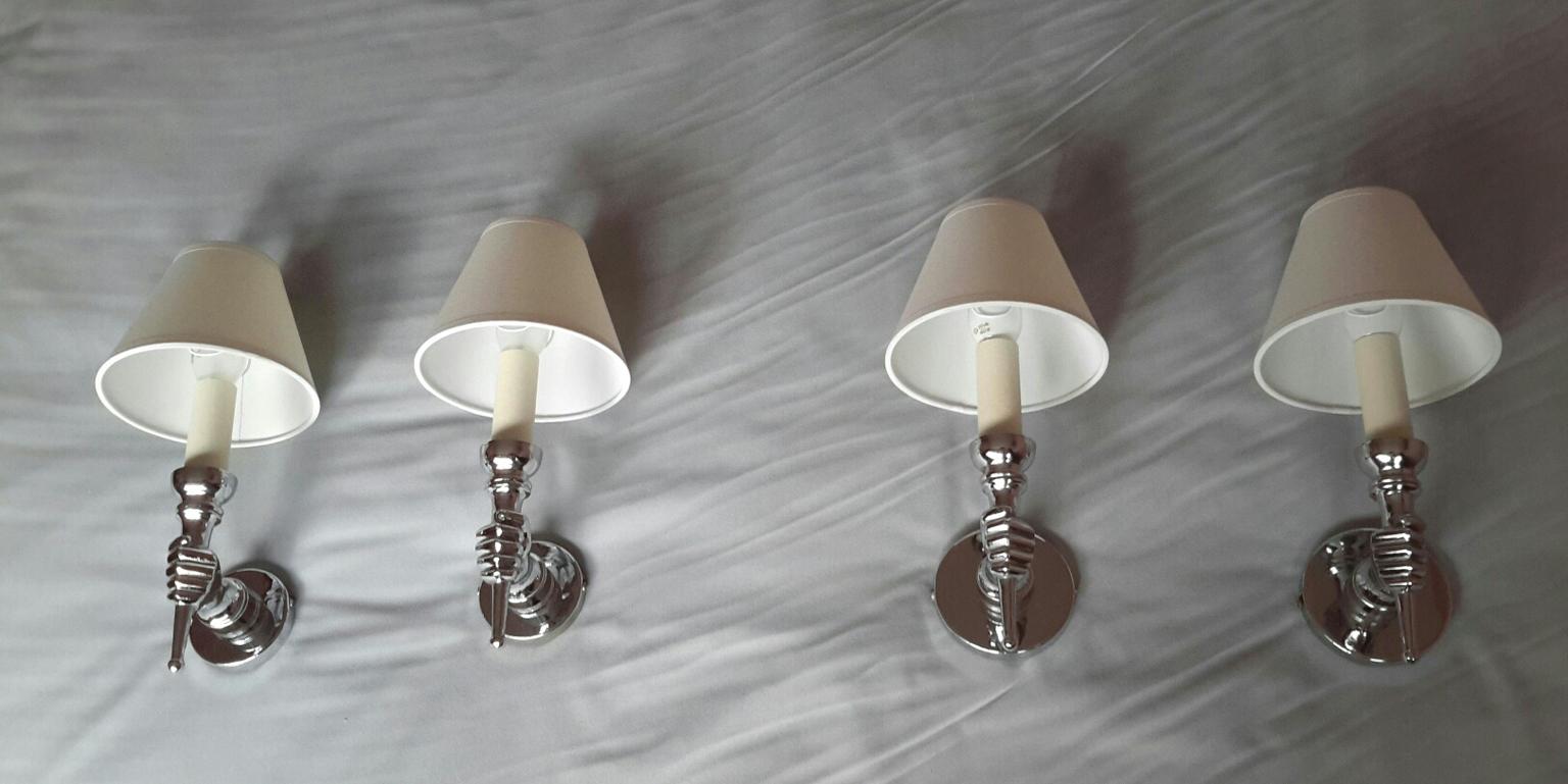 Set of two beautiful pairs of French neoclassical hands sconces of the 1950s after André Arbus. The sconces are in an excellent general condition. The electric part has been renewed and fits the US standards, they come with new white cotton
