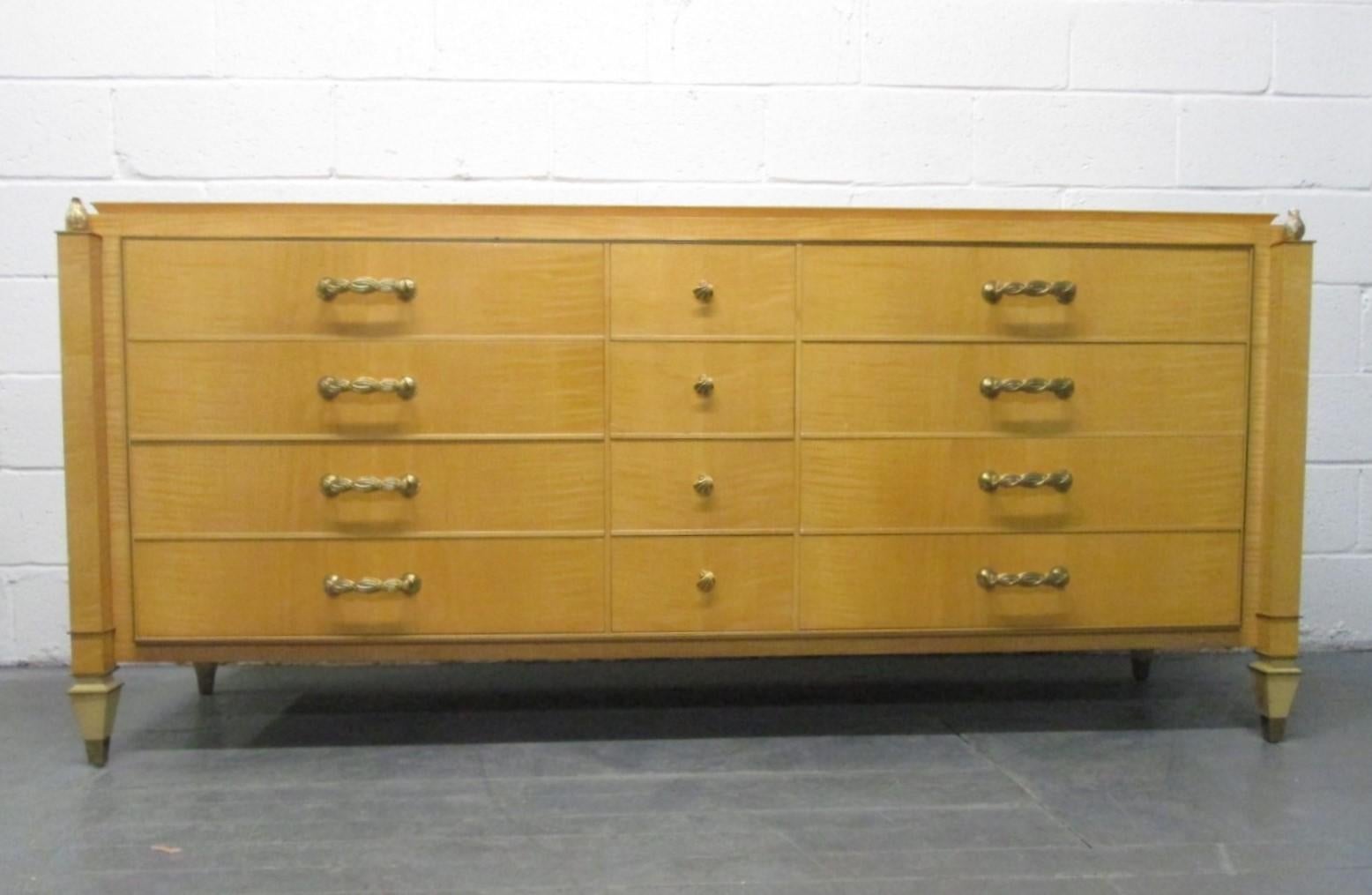 Andre Arbus French dresser has 12 drawers, decorative brass handles and the dresser is satin wood. Well-made and sturdy.