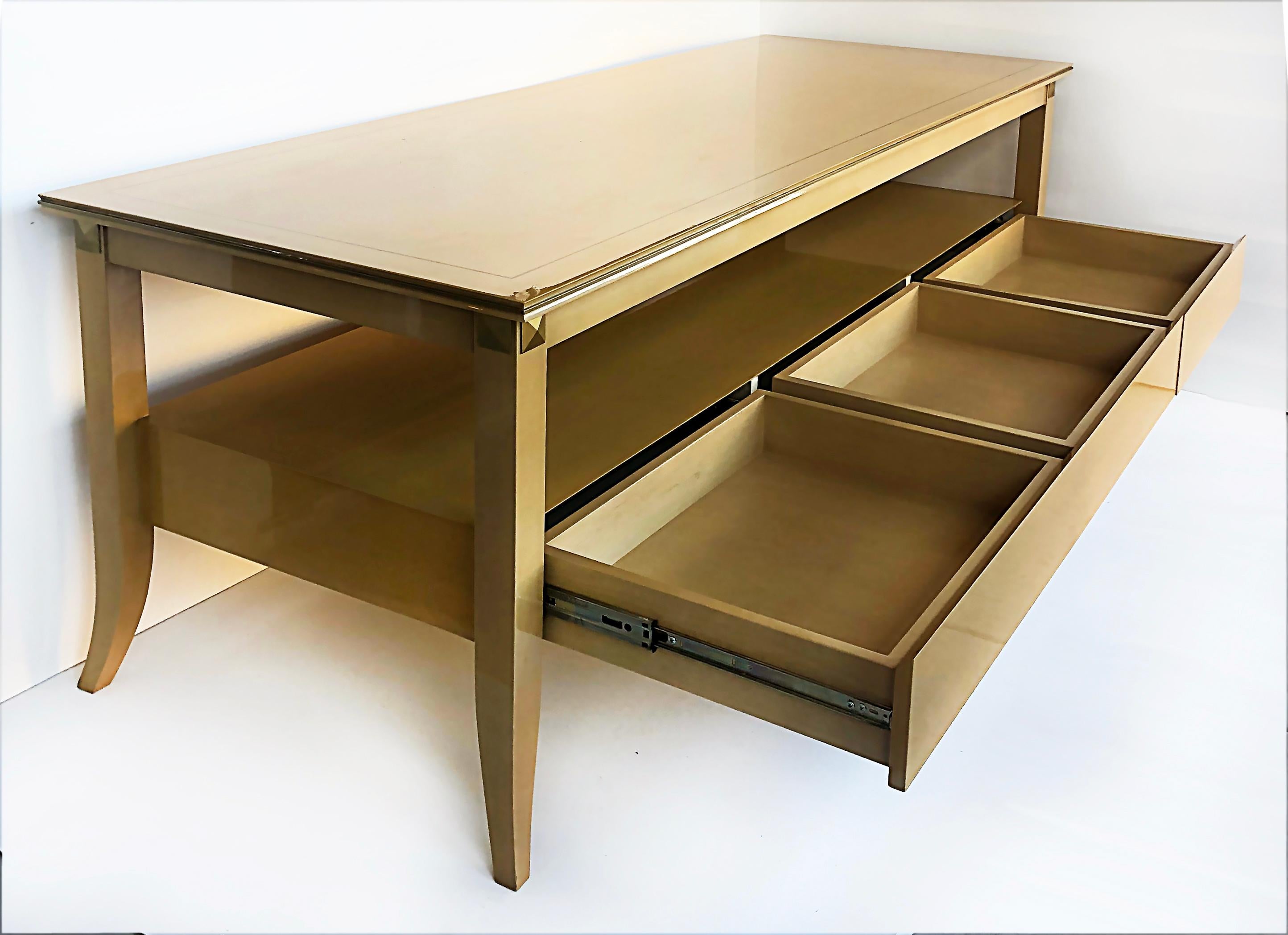 Andre Arbus Style Lacquered Birch Wood Console Table with Brass Inlay 

Offered for sale is an Andre Arbus style lacquered birch wood console table with four splayed legs, and lower storage shelf above, three side by side drawers. The top of this