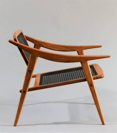 Andre Baudoin Rare Pair of Cane and Oak Lounge Chairs