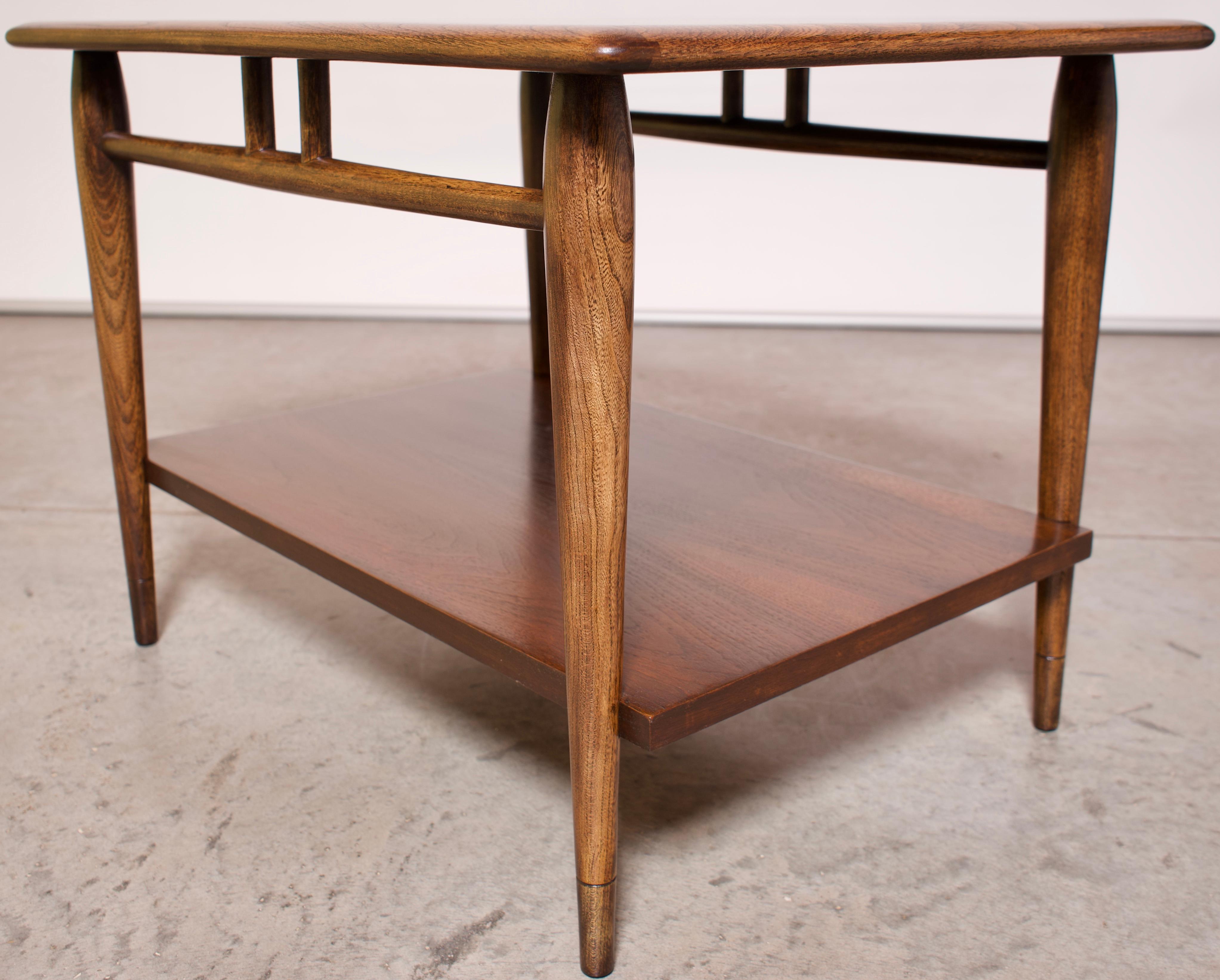 Andre Bus for Lane Acclaim Gunstock walnut side table. Acclaim series side table with shelf by Andre Bus for Lane. The Acclaim series side table features a two-tone top made of gunstock walnut with pecan dovetail inlays, rounded tabletop edges,