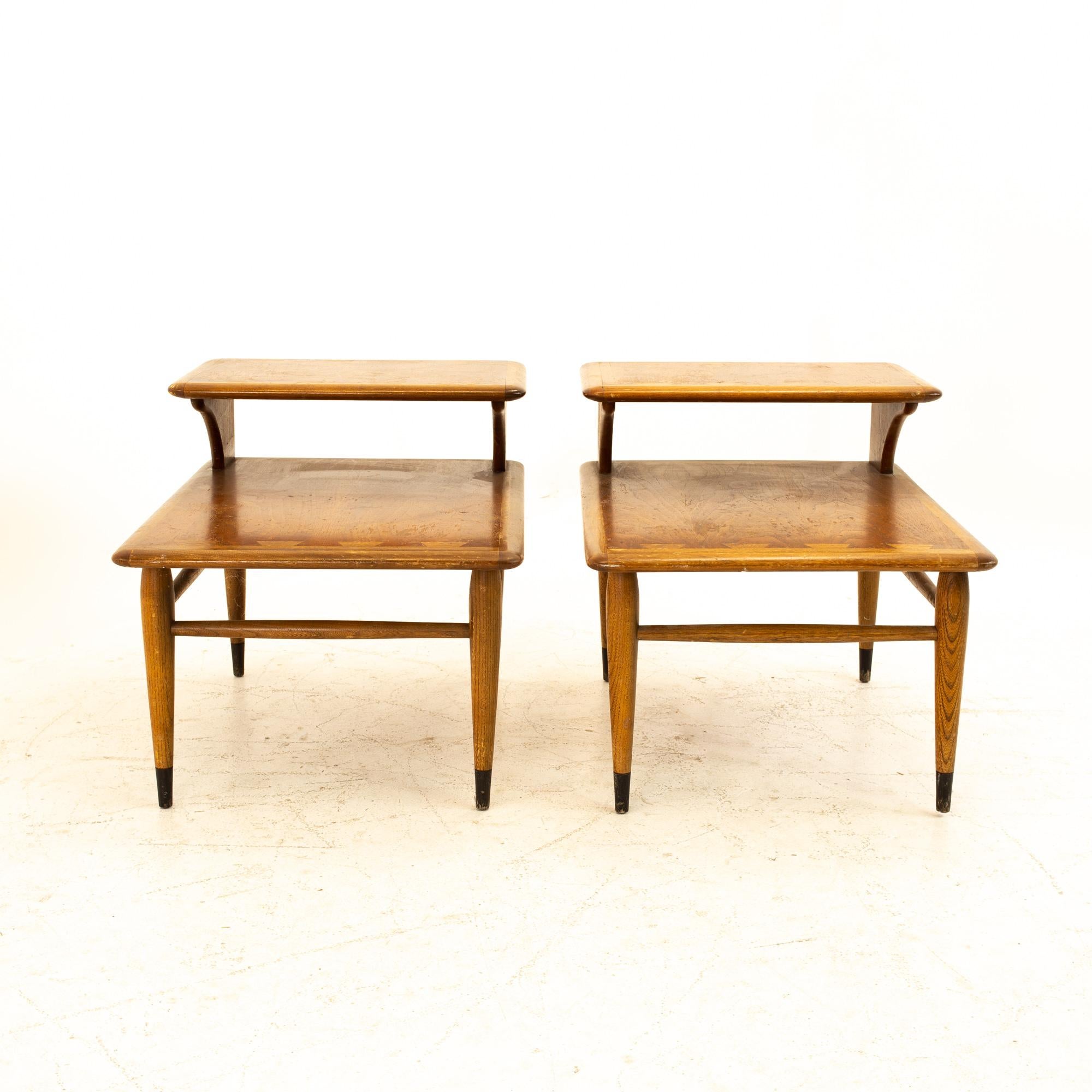 Andre Bus for Lane Acclaim mid century walnut dovetail step side end tables - pair

Side table measures: 21 wide x 27.5 deep x 20.5 high 

All pieces of furniture can be had in what we call restored vintage condition. That means the piece is