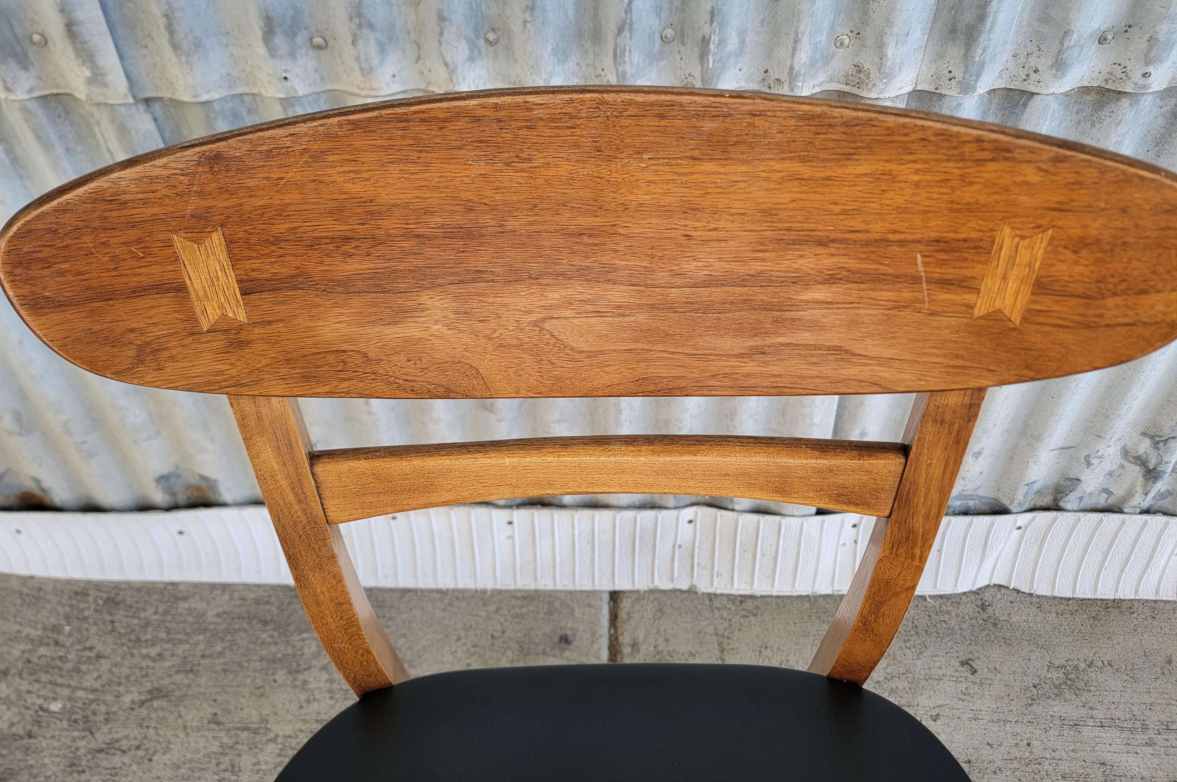 A pair of Mid-Century Modern dining chairs designed by Andre Bus for Lane Furniture. Lane's Acclaim furniture line, Circa. 1960's. Original upholstery and finish. Structurally solid.

32 inched High.
21 inches Deep.
19.25 inches Wide.
Seat Height 18