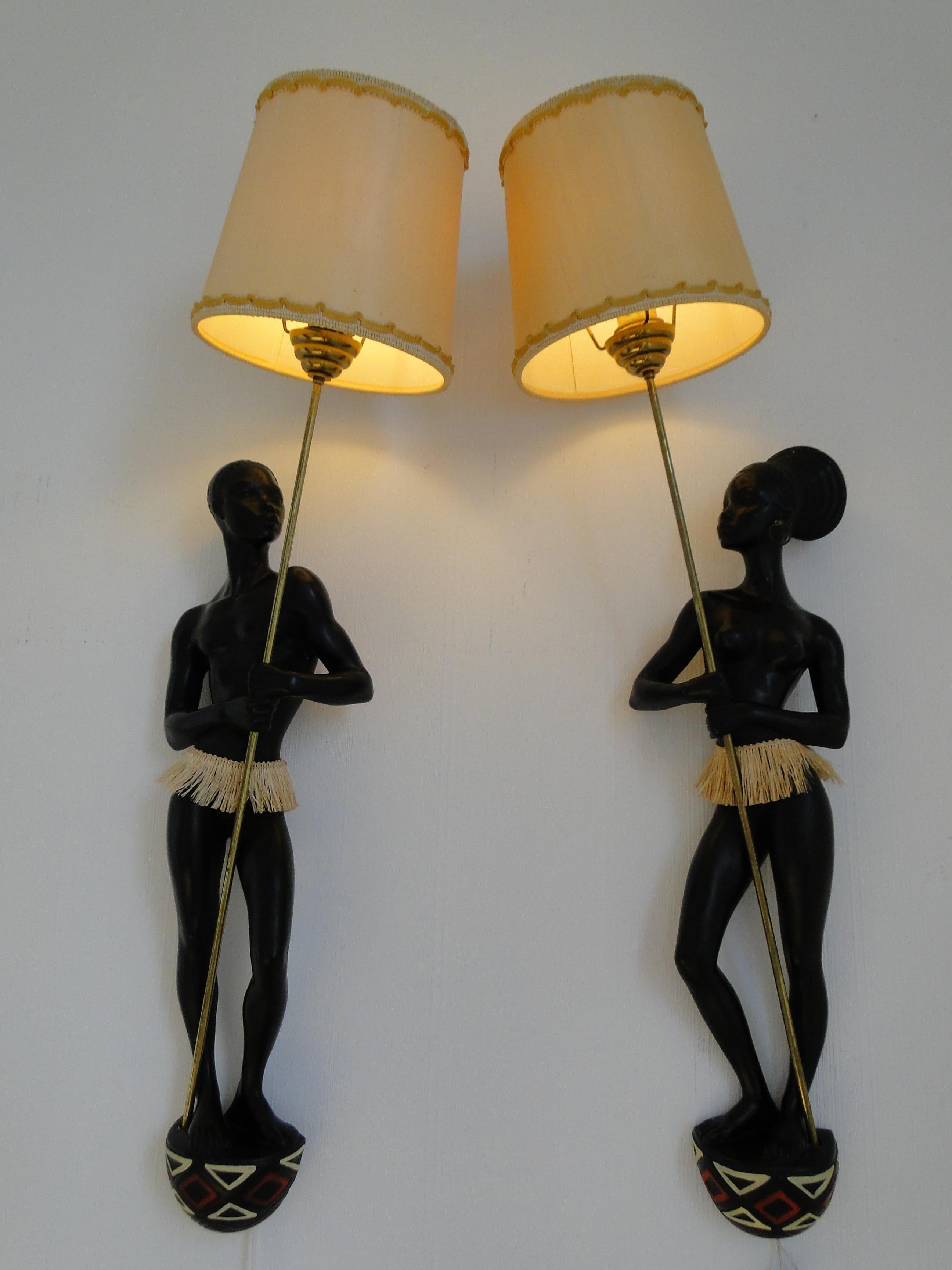 Pair of 1950 French signed Andre Carli sconces figuring à African couple holding à spear.

This sconces works whit all curents 
110 Volts / 220 Volts.

