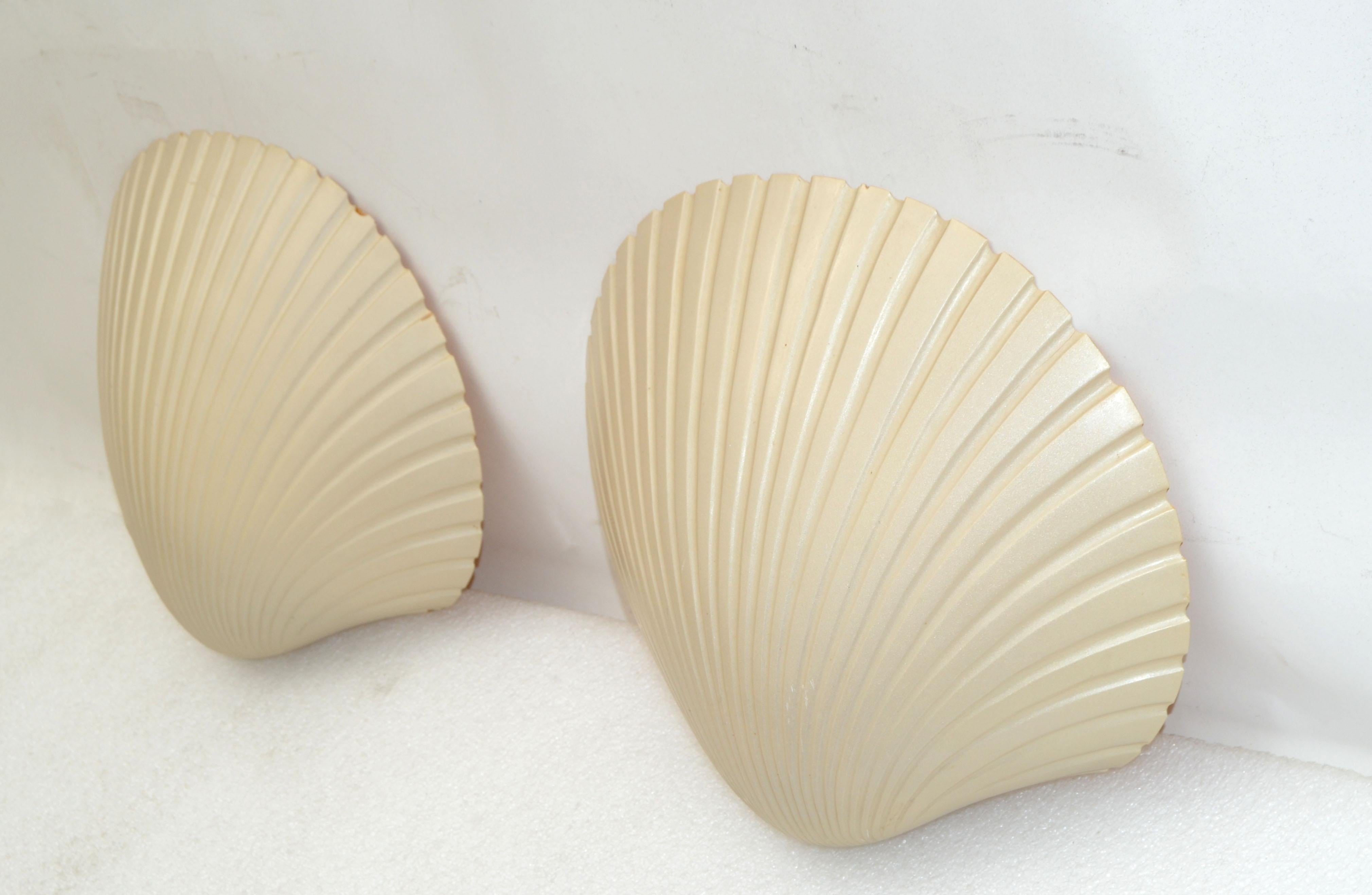 Nice pair of fiberglass 'St Jacques' sconces, wall lamps by Andre Cazenave. 
Mid-Century Modern design made in Italy in 1975.
Each Scallop Shell takes one light per sconce, 40 watts max. US rewired and in working condition.
Have a look on our