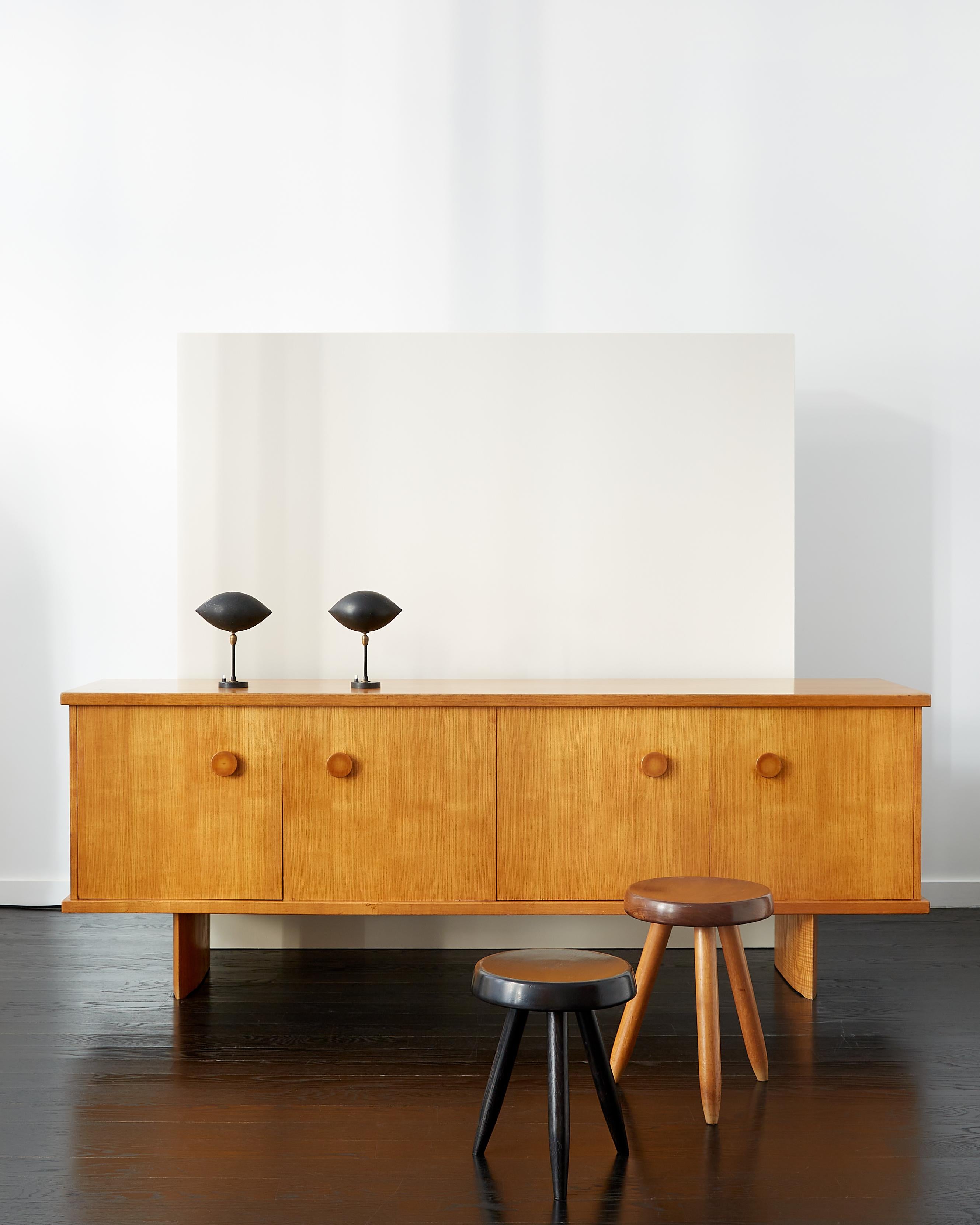 André Chetaille four-door cabinet in ash sitting on elliptical legs. 

France c. 1965. 

Handles are tapered turned ash and interior with five adjustable shelves and two drawers. 

André Chetaille (1906-1978) was Charlotte Perriand’s master cabinet