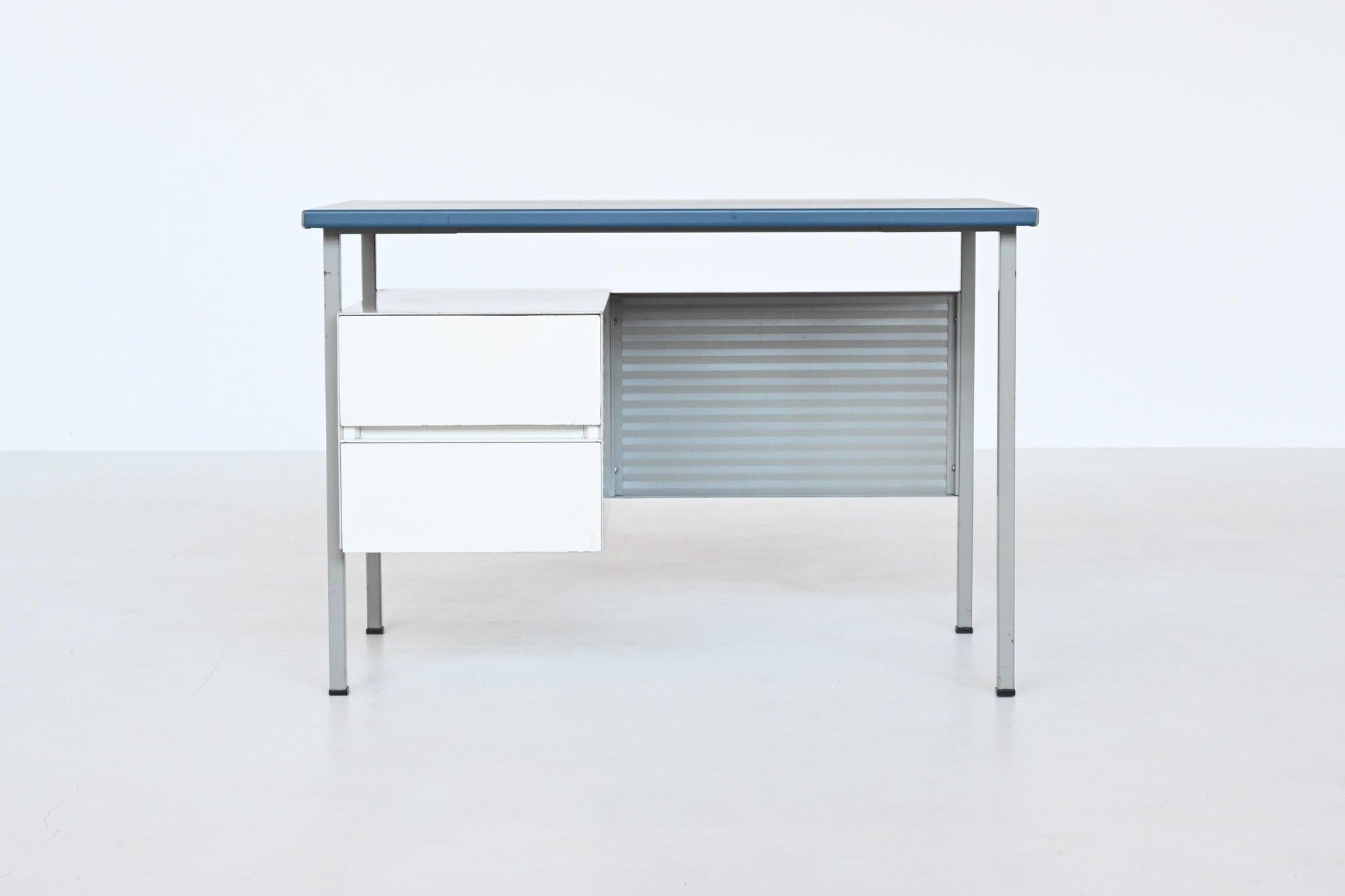 Very nice industrial desk model 3803 designed by Andre Cordemeijer and manufactured by Gispen Culemborg, The Netherlands 1959. This iconic desk is made of light and medium grey lacquered metal with two white drawers and a blue vinyl top. Nice