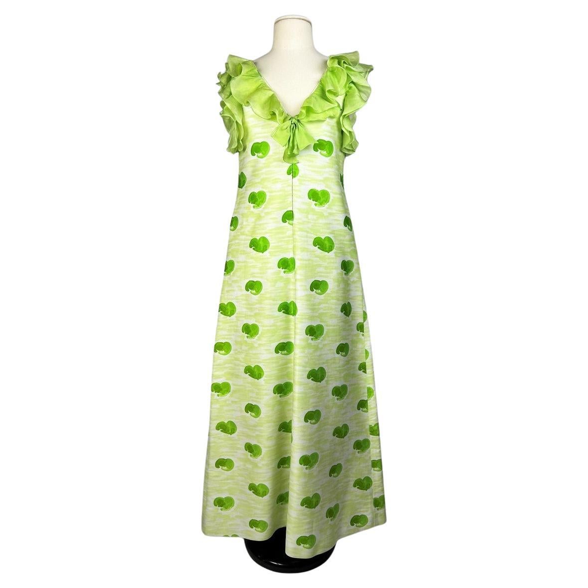 André Courrèges Chasuble dress in green and yellow printed jersey Circa 1970 For Sale