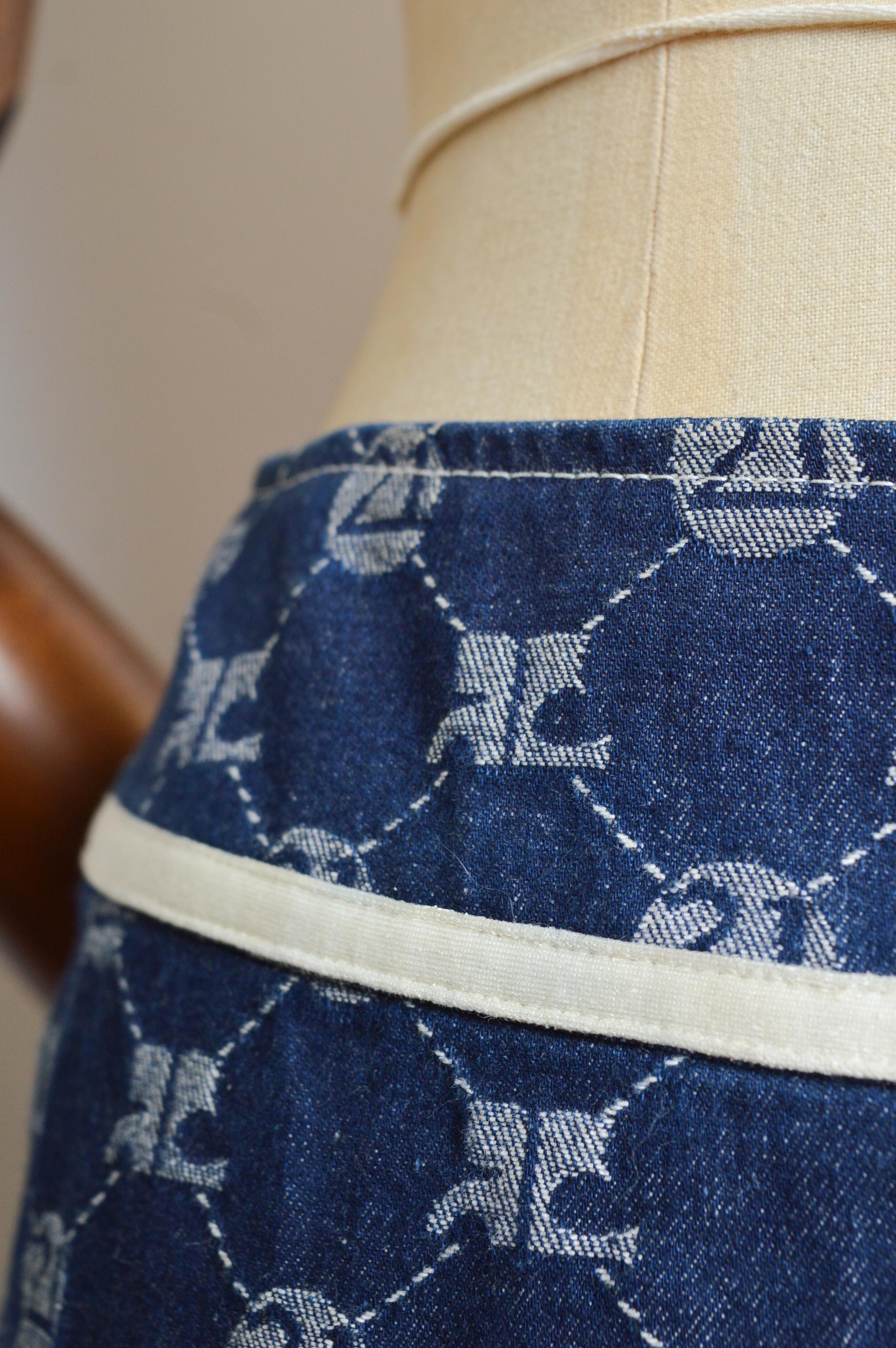 A Superb Vintage André Courrèges jacquard Denim skirt with pleated detail, full logo exterior and white piping detail. 
Recommended Size; 28” Waist. (UK 8)
Measurements are provided in inches (‘’)
Waist; 28