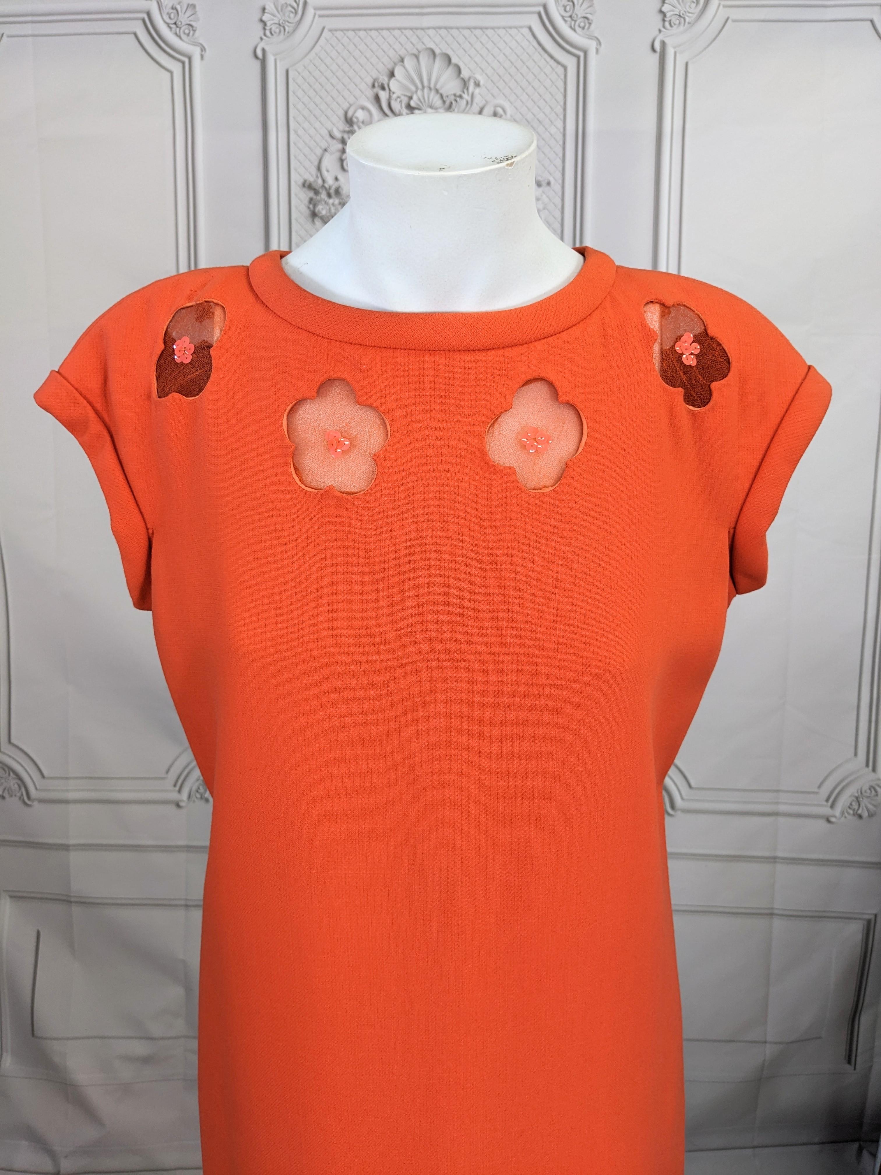 Andre Courreges Couture Pop Maxi Gown of vibrant orange wool with sheer floral inserts at neckline with sequin centers. Clean lined silhouette with slight A lined flare at hem. Designed to showcase the form, color and shape as well as the client.