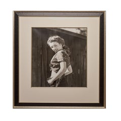 Marilyn Monroe "Over the Shoulder', 1945. A black and white portrait.