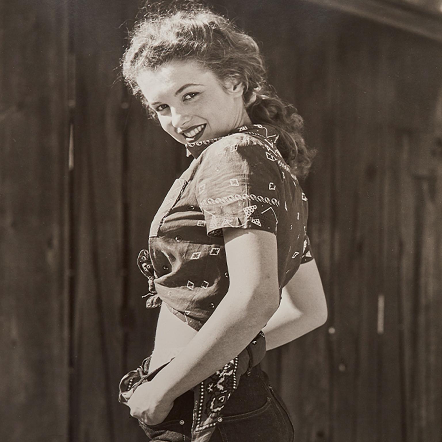 Andre de Dienes Portrait Print - Marilyn Monroe "Over the Shoulder
, 1945. A black and white portrait.