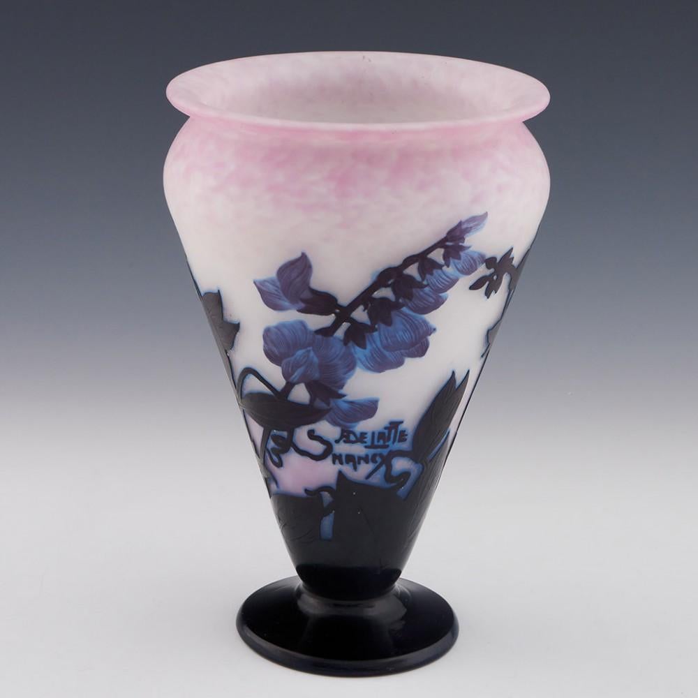 Andre Delatte Cameo Glass Vase, c1925

Additional information:
Date : c1925
Origin : Jarville, Nancy, France
Bowl Features : Composite flower heads and leaves in amethyst, African violet and blue over a mottled purple and white ground
Marks : Cameo