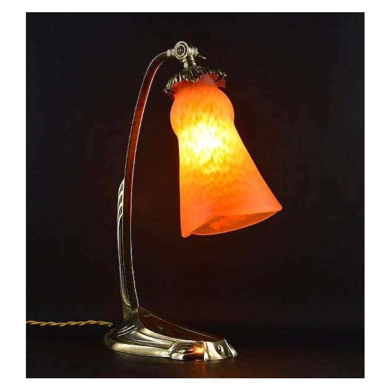 Summer sales. We are renewing our stock waiting for the start of September. Do not wait to order these beautiful pieces. French Art Deco desk or table lamp by Andre Delatte, Jarville near Nancy, France, late 1920s. Mottled blown double glass shade,