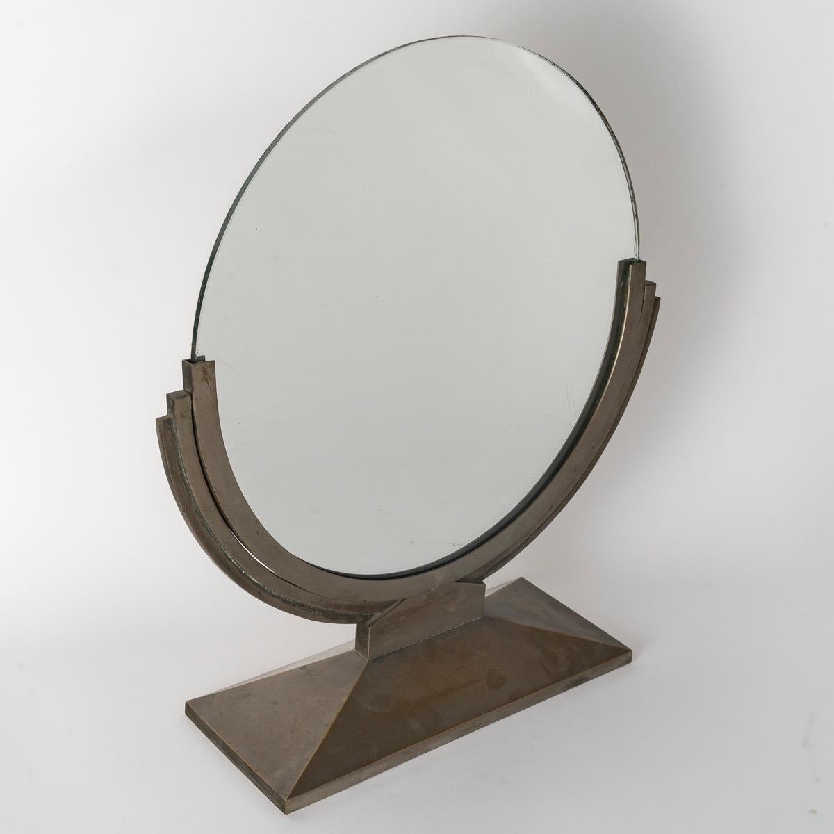 André Domin (1883-1962) & Marcel Genevrière (1885-1967) for Maison Dominique,
A French Art Deco Coiffeuse Mirror 
With solid nickel-plated metal and reclining round mirror
On a step-up rectangular base
Circa 1930

During the early 1920s — just as