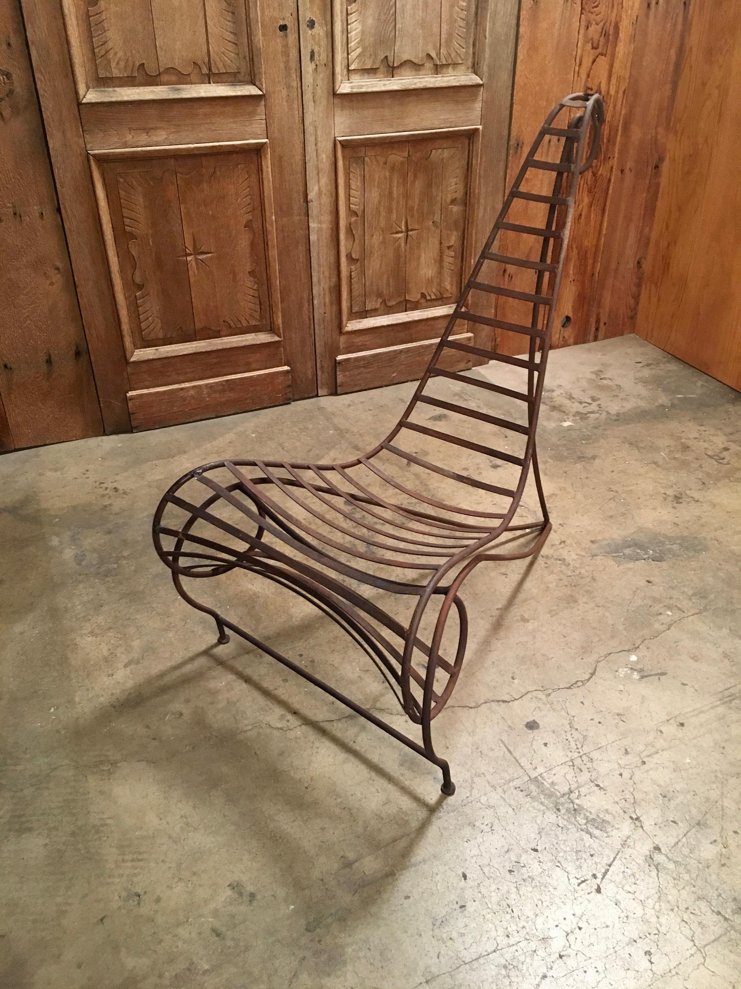 This spine chair is a work of art perfect for garden or home with nice rust patina.