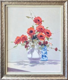 Still life with a vase of red flowers.