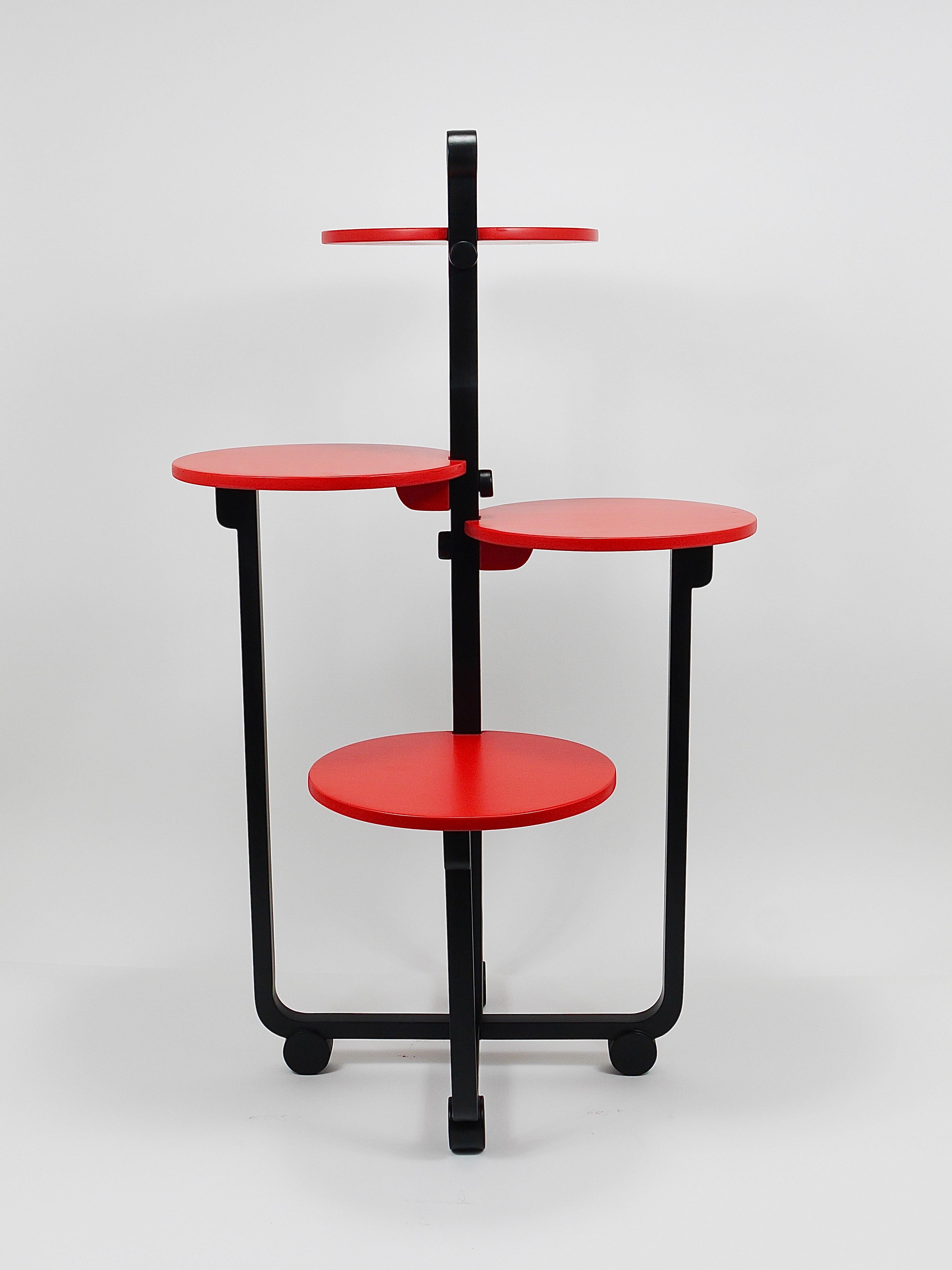 A beautifully elegant four-tier Art Deco modern étagère / flower bench / plant table from the 1920s. Designed by renowned French decorator and furniture designer André Groult (1884–1966). Crafted from wood, it features a black frame with a graceful