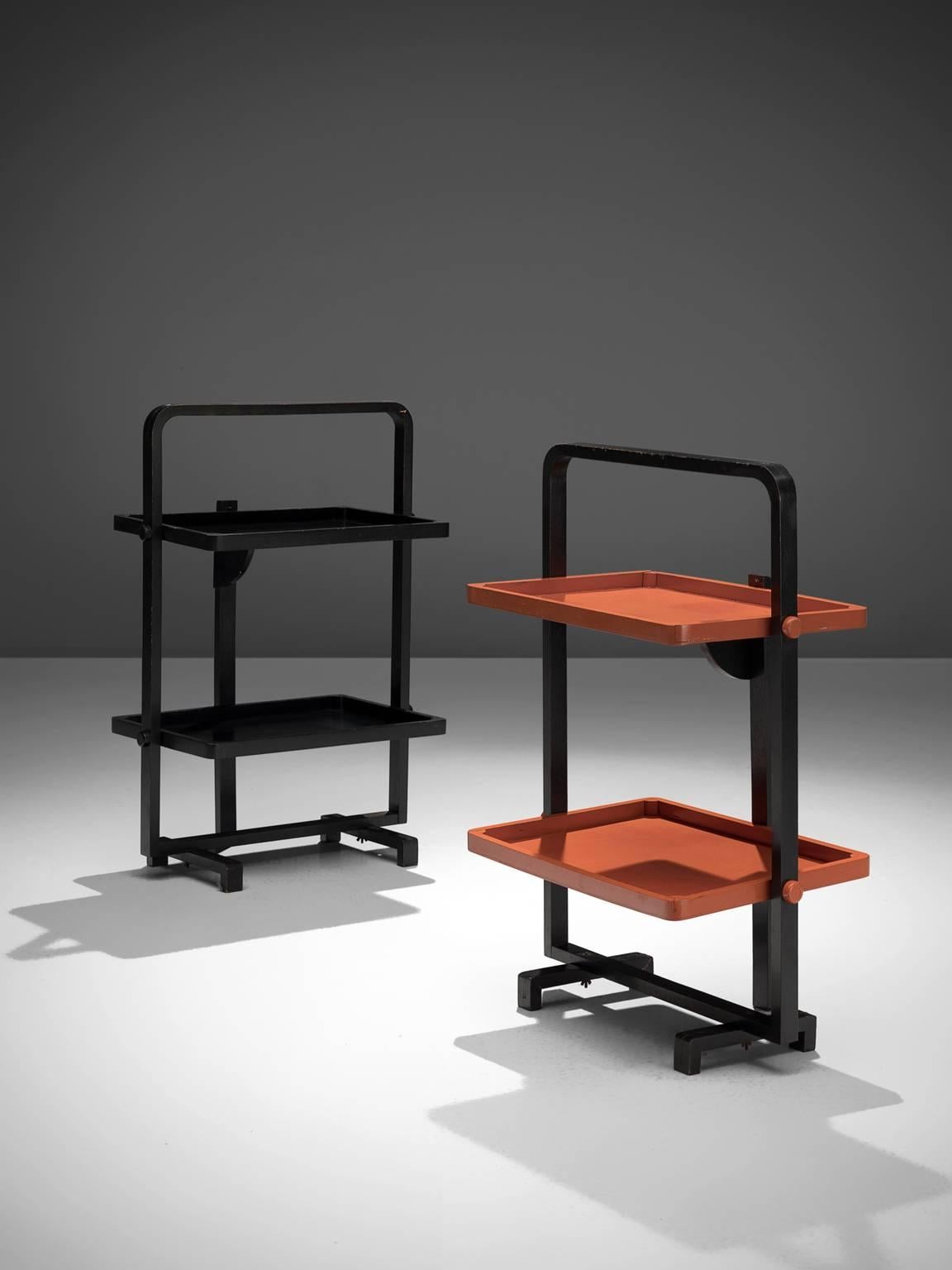 André Groult, pair of tea trays, wood, France, 1930s.

These folding tea trays are designed by André Groult. One piece is all black whereas the other piece is black and orange, both forming a strong singular item even though they are not large.