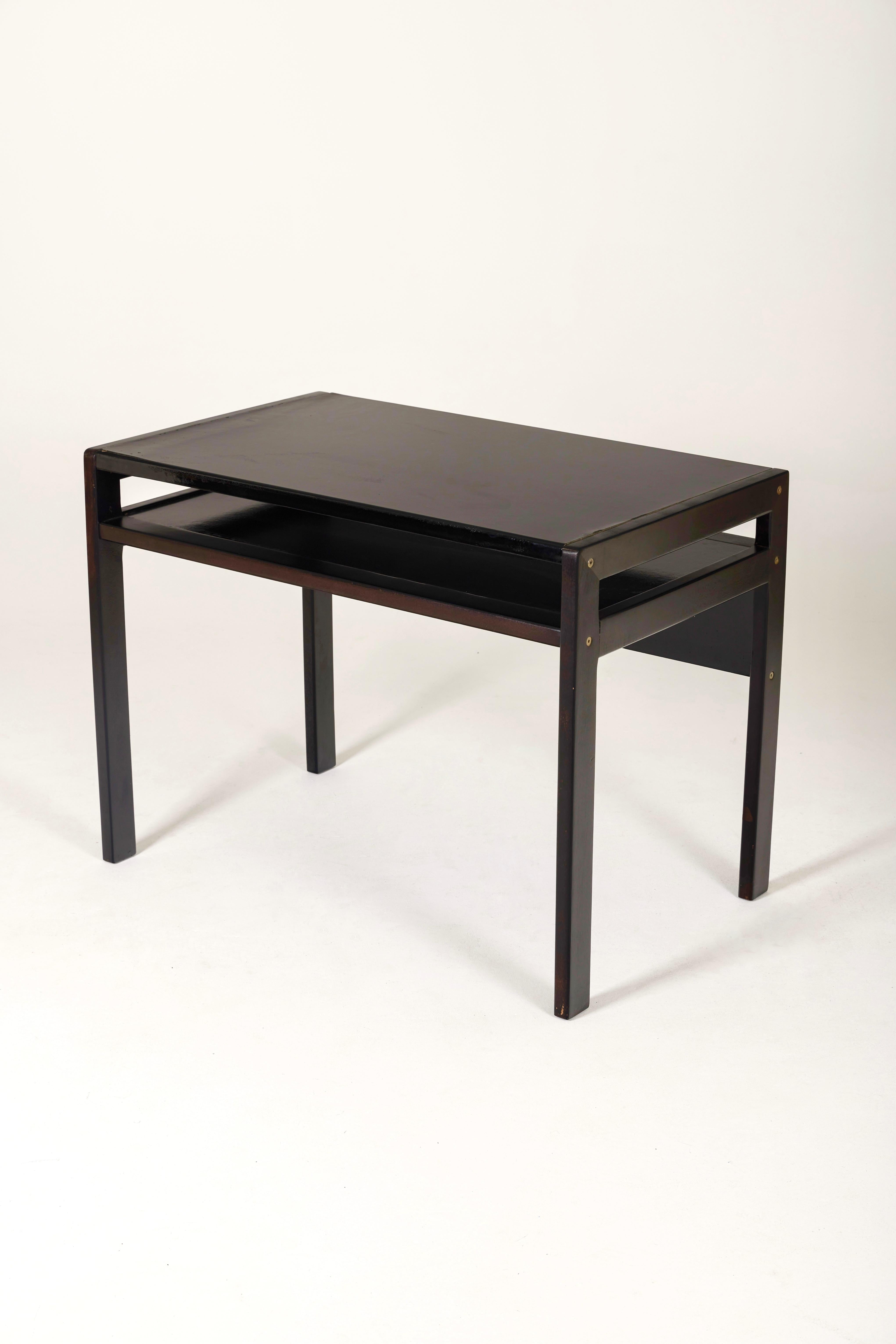 Desk by Lyon designer André Sornay from the 1960s. The structure and top are in black lacquered wood. Traces of wear are to be noted, it has been relacquered. This desk with pure, geometric lines and harmonious proportions will go well with