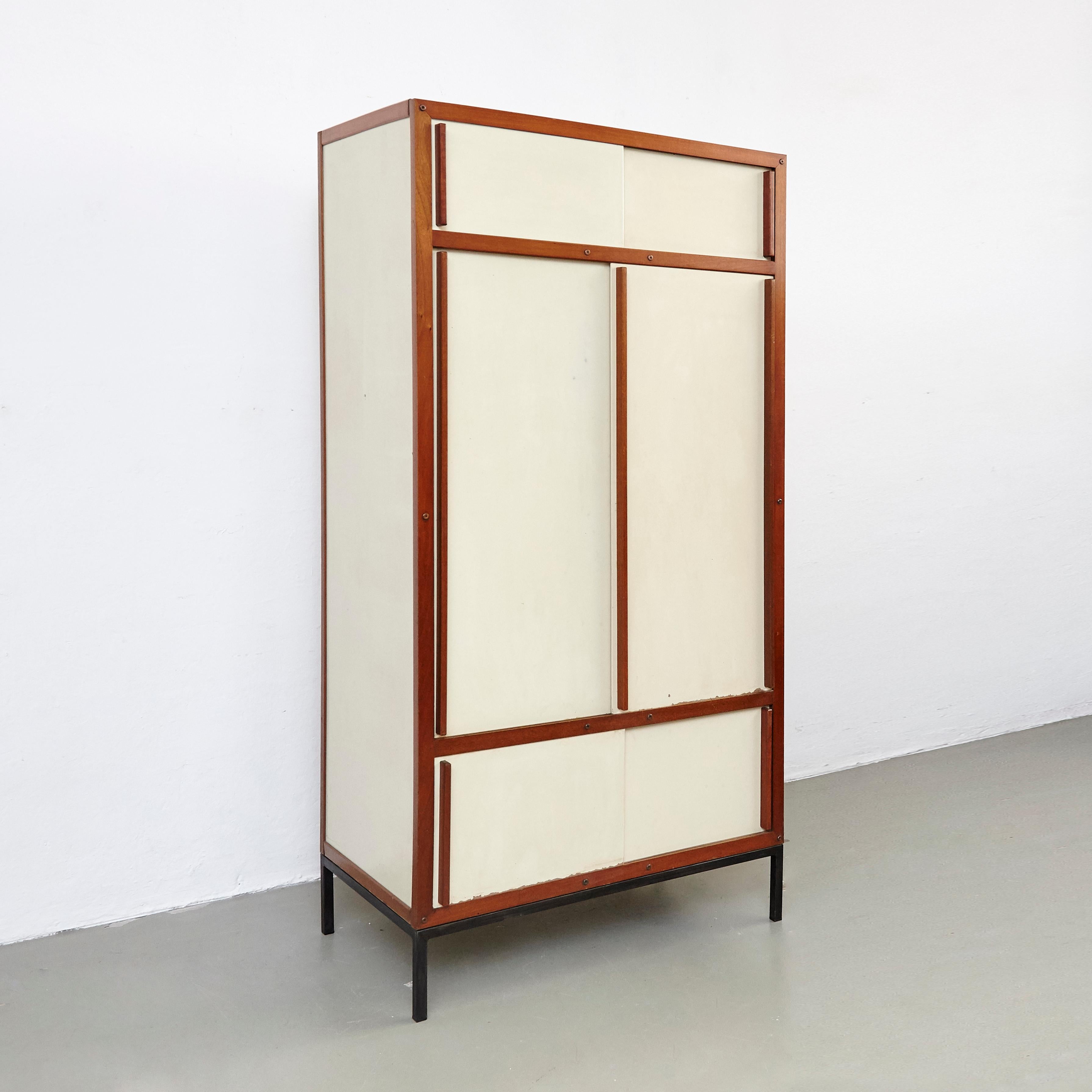 Cabinet designed by André Sornay.
Manufactured in France in 1950s.

In original condition with minor wear consistent with age and use, preserving a beautiful patina.
The metal base structure is redone.

André Sornay (France, 1902–2000) joined