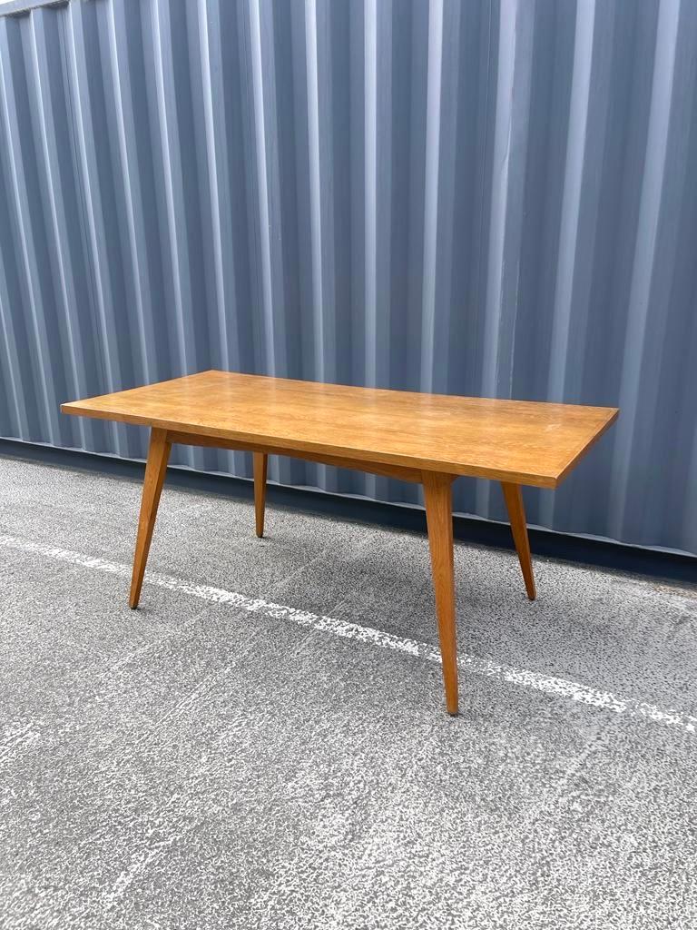 André Sornay dining table 
Circa 1950.
The structure is in walnut and the nails are in brass, aligned, taking up all the contours of the furniture.
Good general condition, wear due to age and use.

Dimensions: W170cm x D90cm x H72 cm.