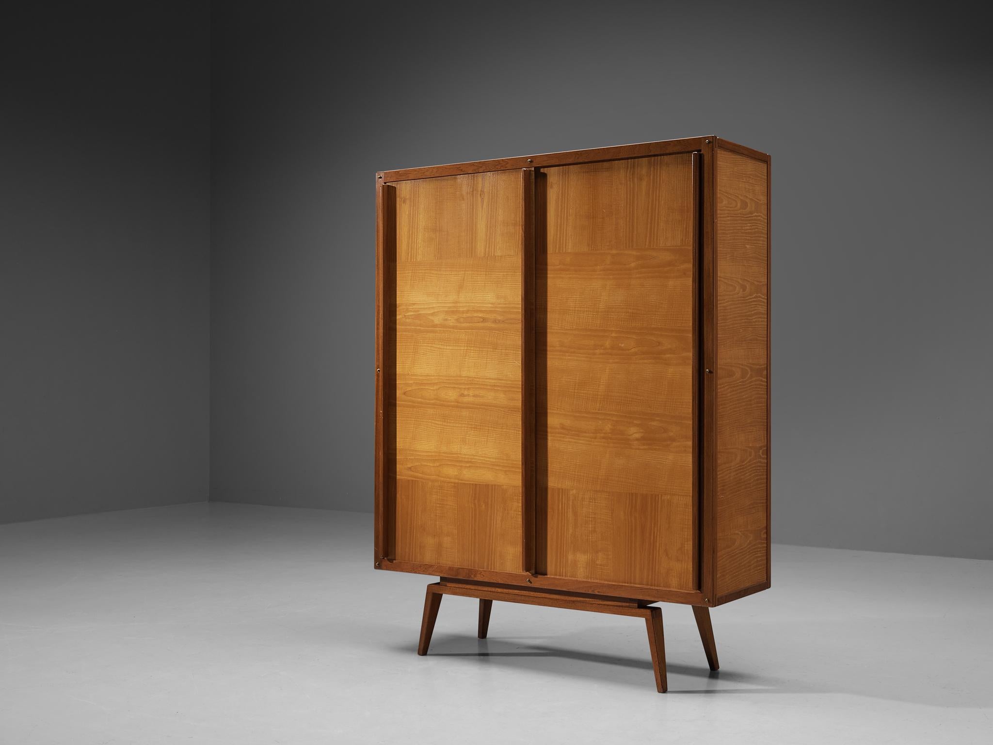 André Sornay for Atelier Sornay, wardrobe or armoire, ash, mahogany, France, 1950s 

Iconic midcentury wardrobe by French designer André Sornay. With its geometric design and the combination of mahogany and ash the appearance awakes the association