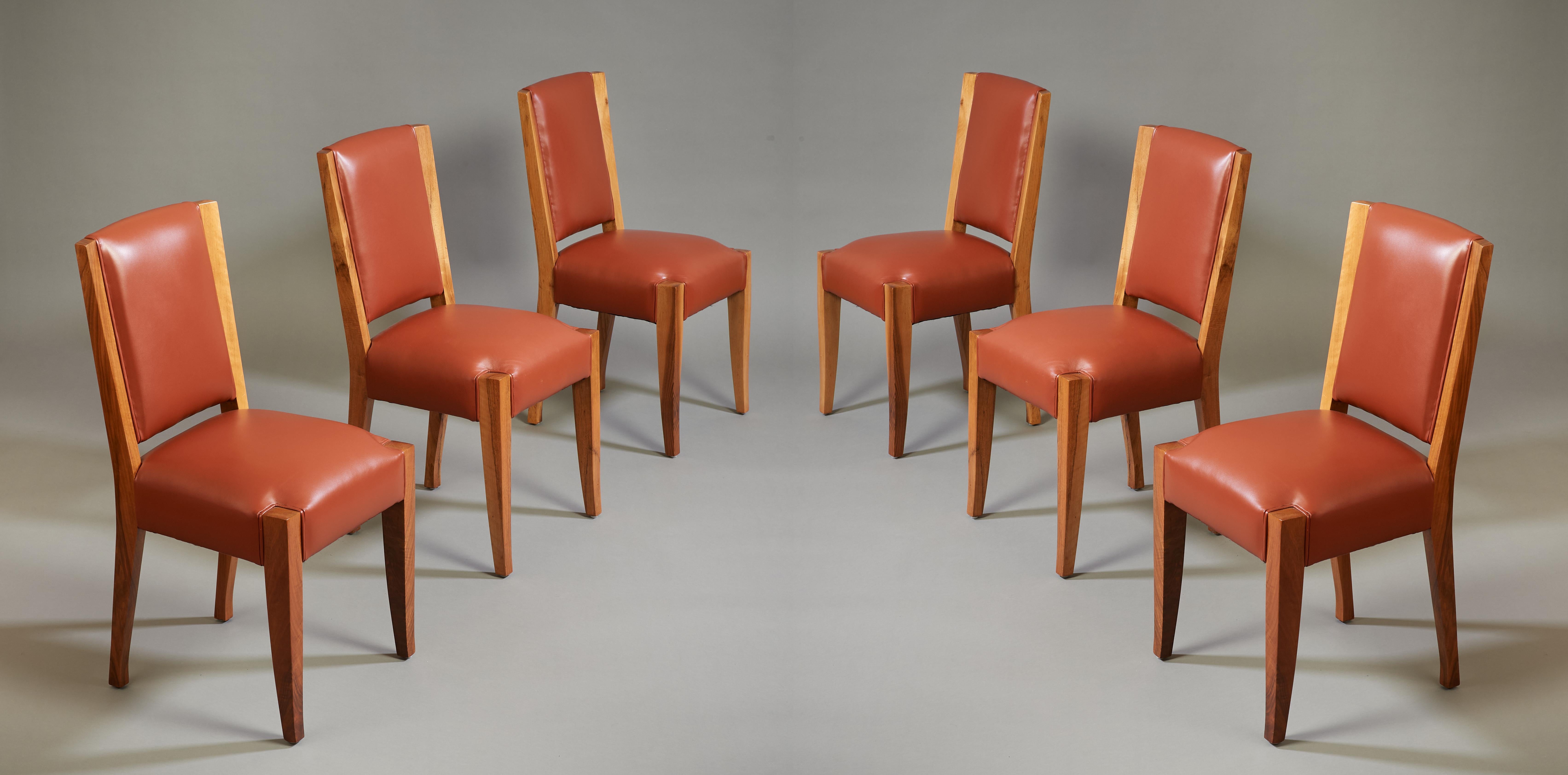 André Sornay (1902-2000)

A beautiful set of six minimalist, pure-lined dining chairs by André Sornay, with subtly curved and tapered backs and elegant sabre legs. In French walnut upholstered in soft burnt umber leather. The chairs' clean,