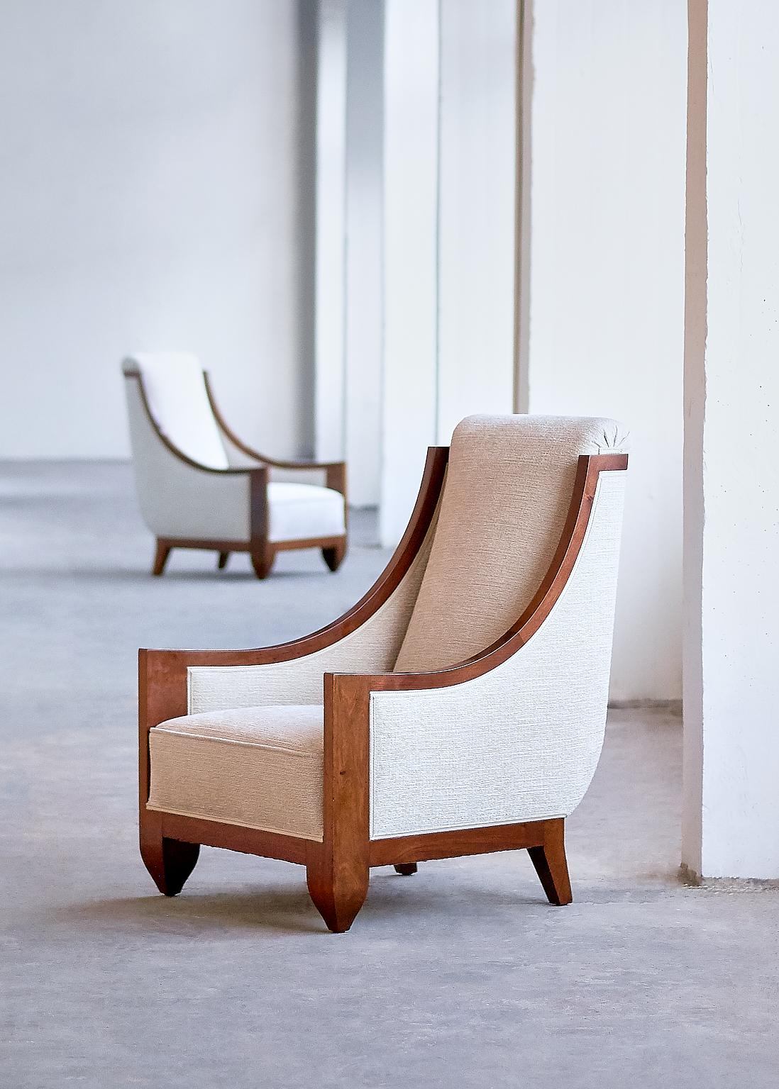 This rare pair of armchairs was designed by André Sornay and produced in his own workshop in Lyon, France in the late 1920s. The solid walnut frame with its curved armrests and striking frontal legs perfectly illustrates the craftsmanship and