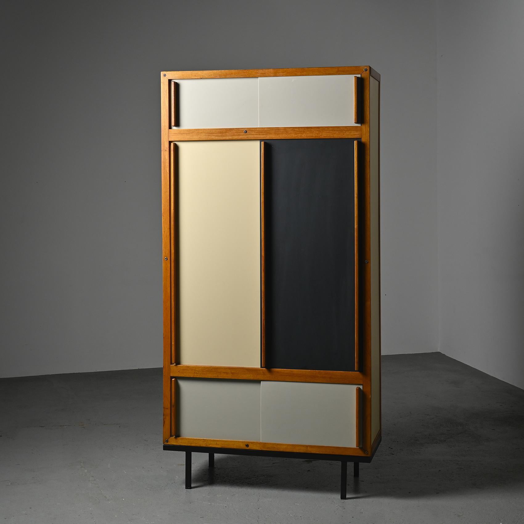   Vintage cabinet with a modernist and minimalist touch by André Sornay, cabinetmaker and designer, produced in Lyon by Meubles Sornay circa 1960.

An iconic design, the mahogany structure accommodates sliding doors lacquered from origin in shades