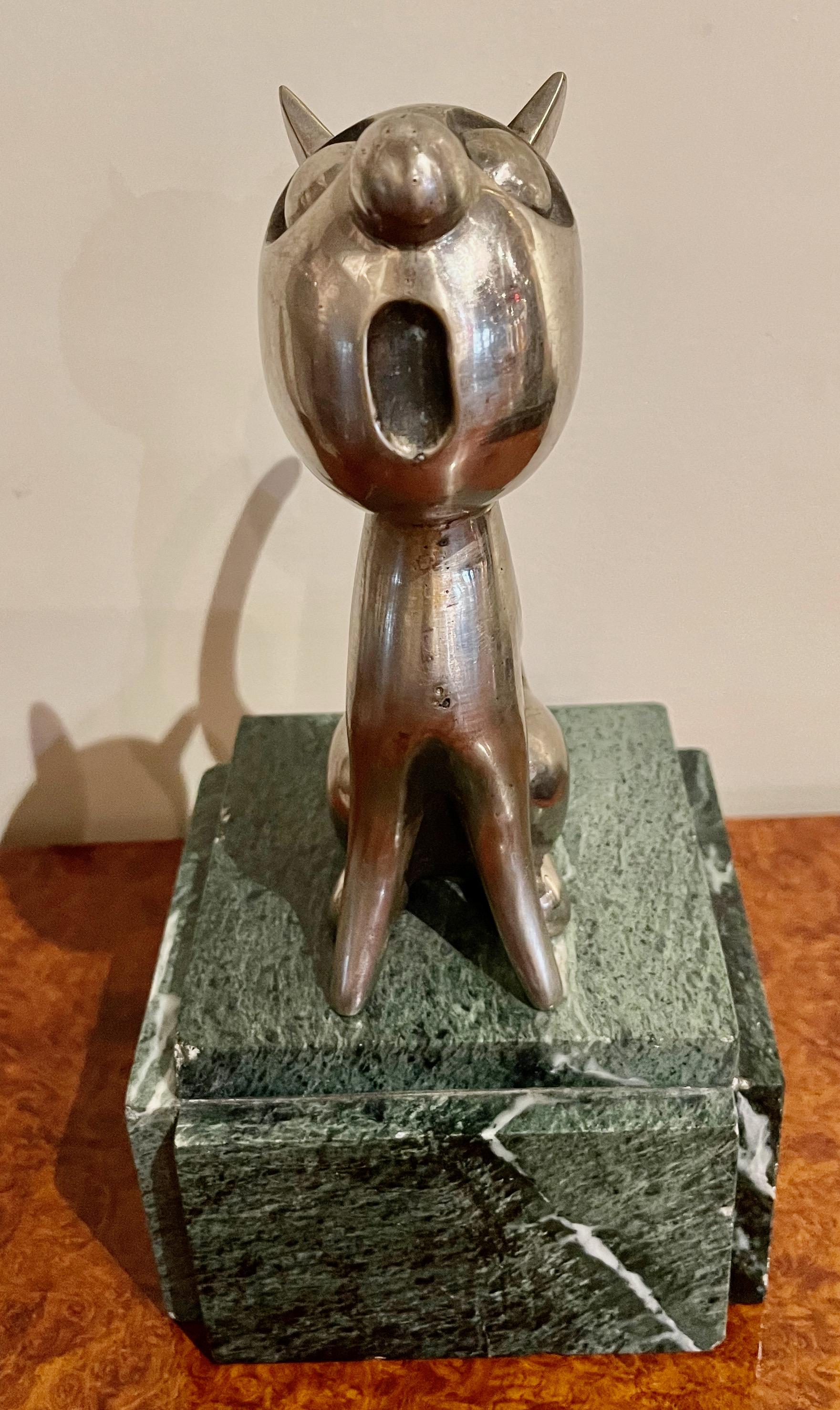 Art Deco bronze of a cat in a caricature rendering stretching with a round mouth and big eyes. Well-known French sculptor Andre Vincent Becquerel French circa 1930. Also known for car mascots and this may have originally been designed for that. This