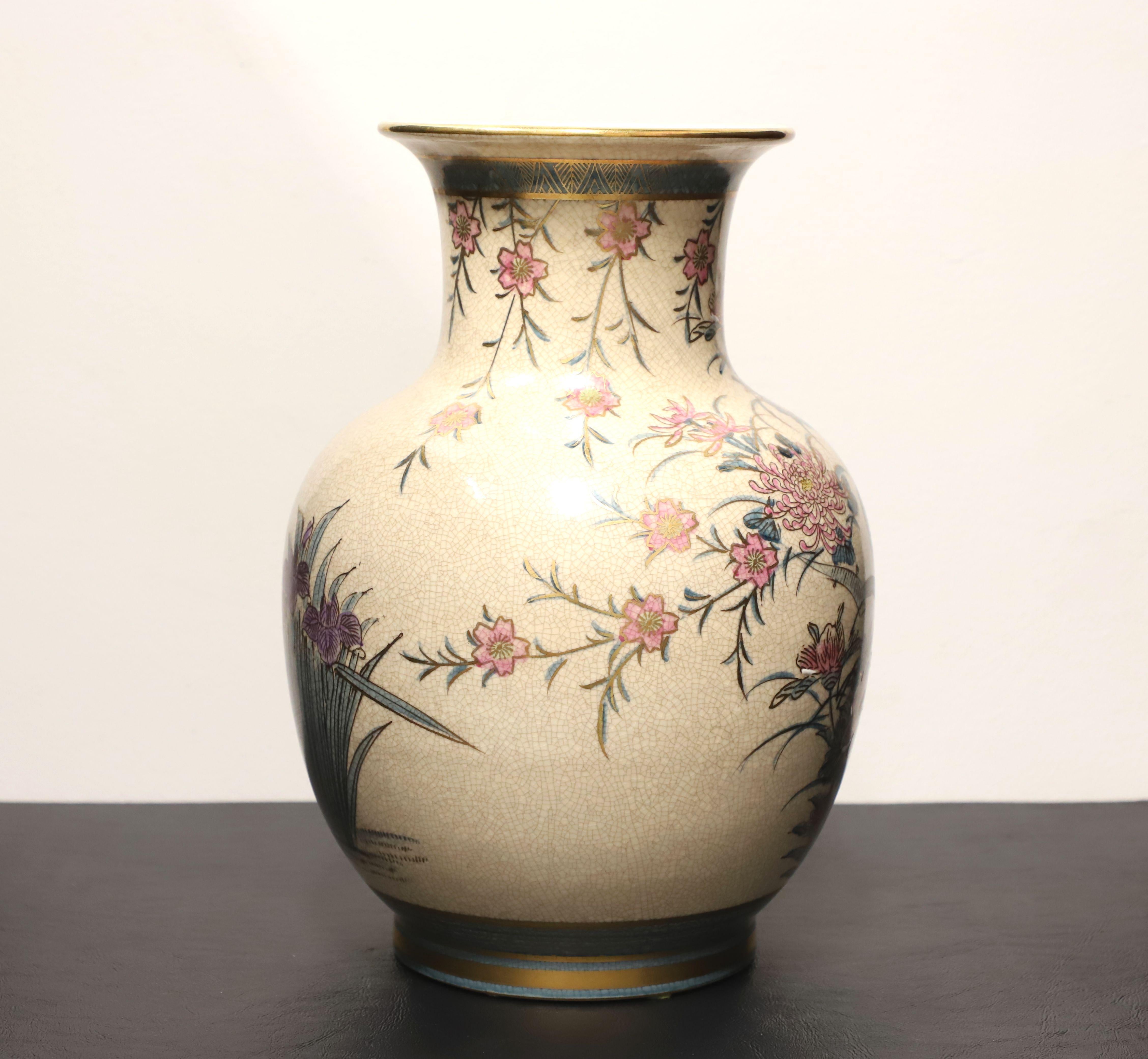 A Japanese Chinoiserie style table vase by Andrea by Sadek. Hand painted ceramic with a Japanese Chinoiserie design of foliate, floral & birds in colorful shades of tan, gold, blue, pink, purple, white & brown colors, and a tapered urn shape with