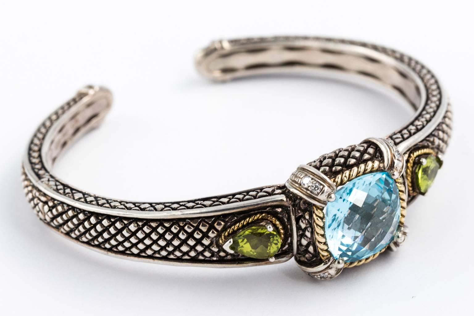 Andrea Candela bracelet, sterling silver, 18 karat, pave diamonds, blue topaz, green tourmaline semi precious stones hinged opening.