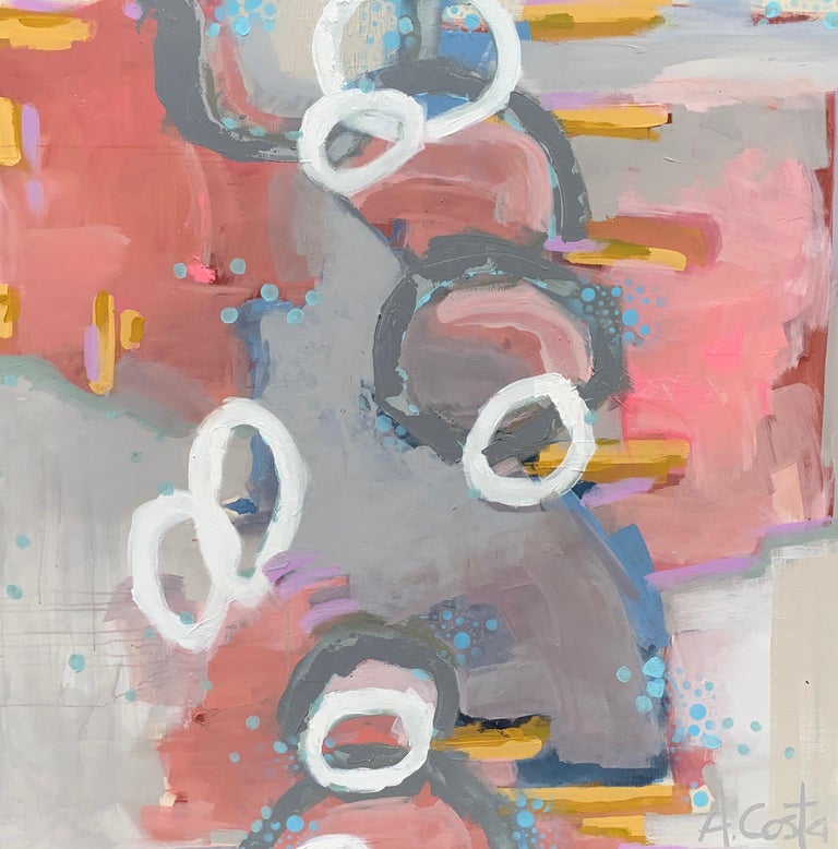 'Swimming Upstream' is a large mixed media on canvas painting of square format created by American artist Andrea Costa in 2021. Featuring a palette made of gray, pink, blue, orange, yellow and white tones, the painting presents a joyous arrangement